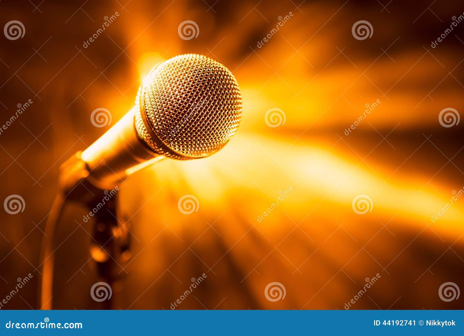 Golden microphone on stage stock image. Image of gold 44192741