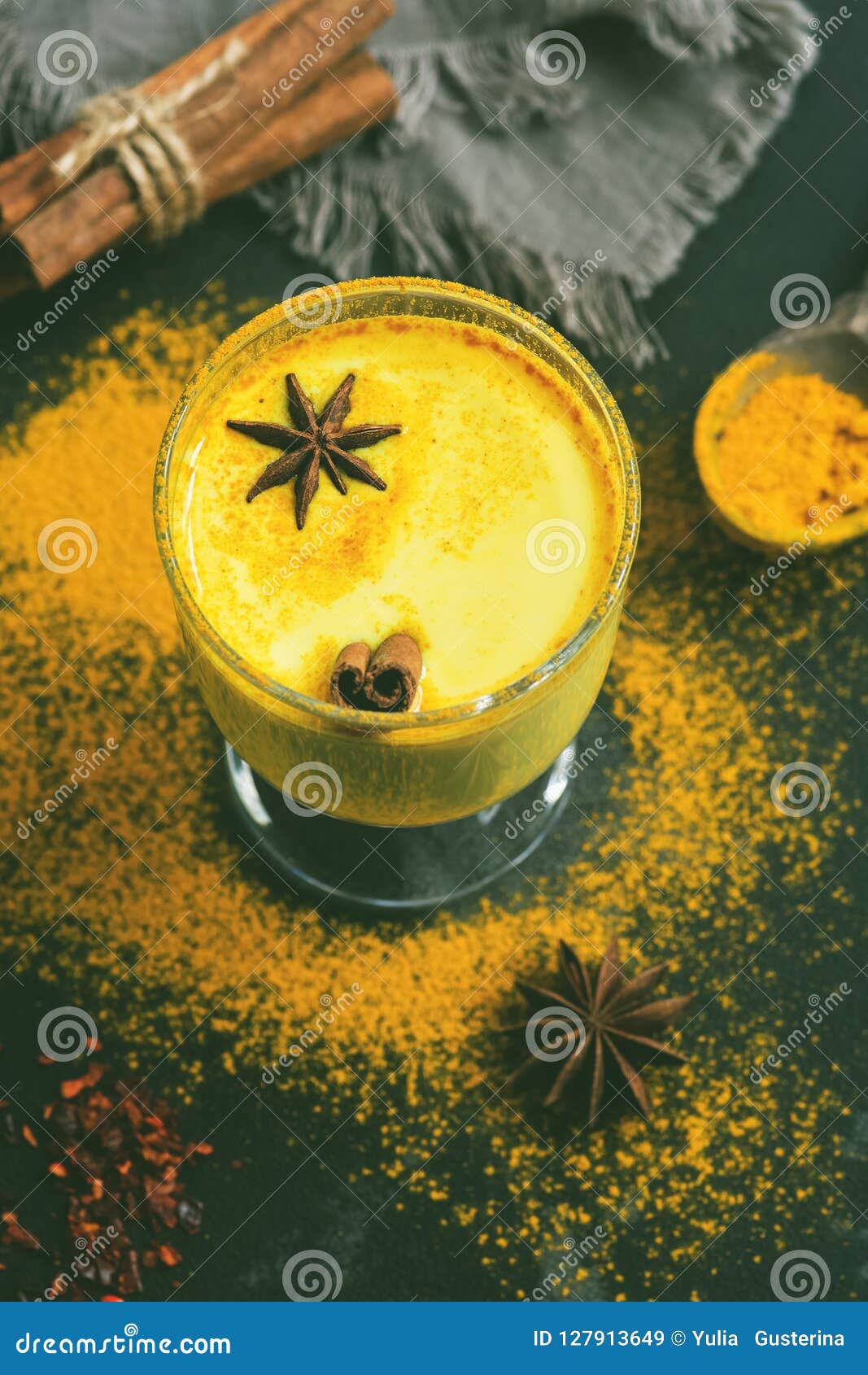 Golden Milk with Turmeric Powder in Glasses on a Dark Rustic Background ...