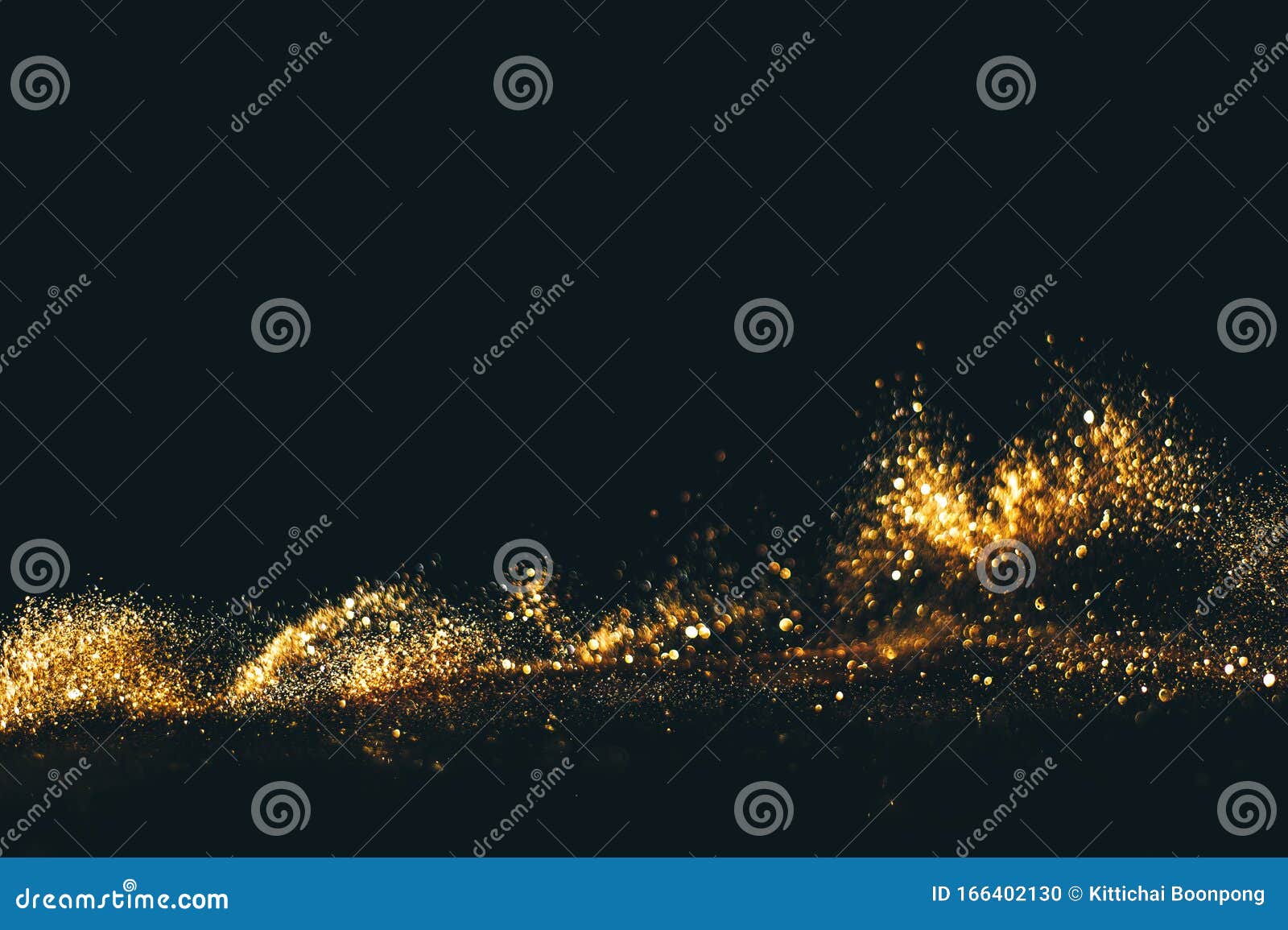 golden overlay background of golden lights with bokeh effect. includes copy space