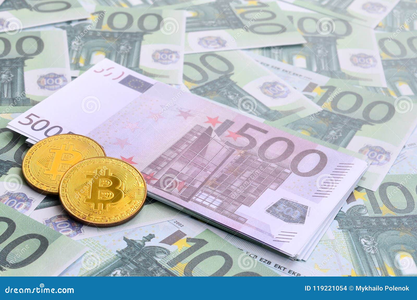 golden physical bitcoins is lies on a set of green monetary deno