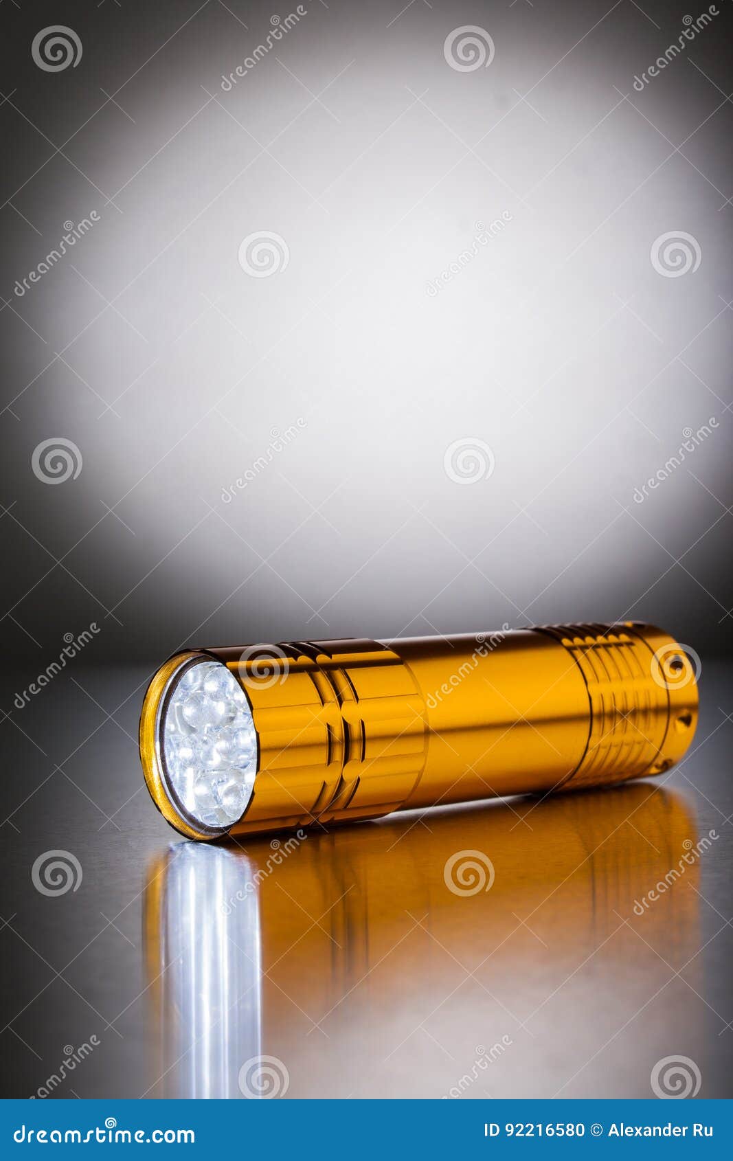 Golden Pocket LED Flashlight. Stock Photo Image of beamillumination