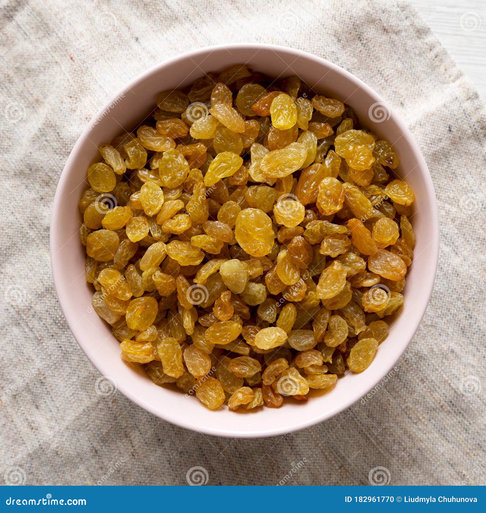 Golden Raisins in a Pink Bowl on Cloth, Top View. Flat Lay, Overhead ...