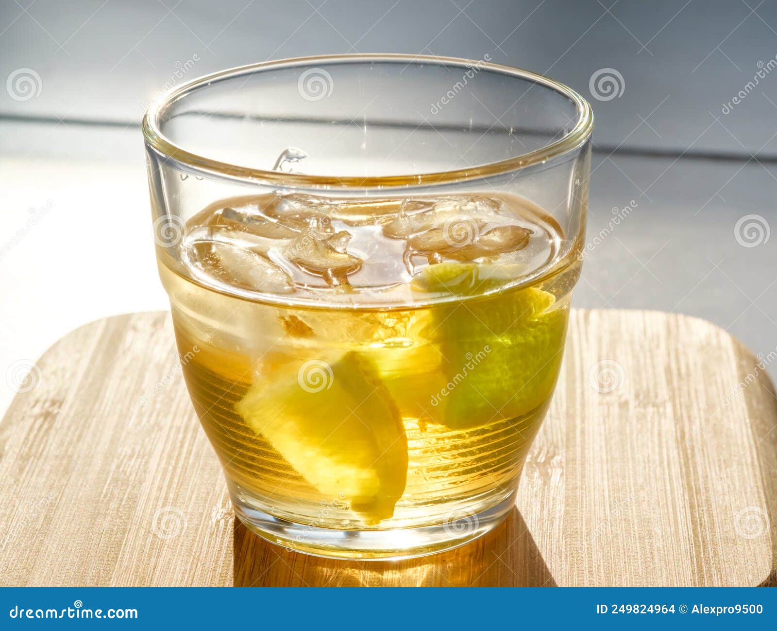 Golden rum on the rocks stock photo. Image of beverage 249824964