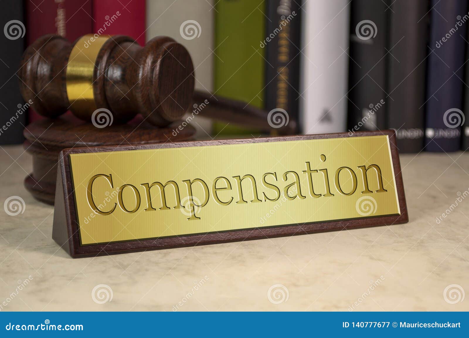 golden sign with gavel and compensation on a desk