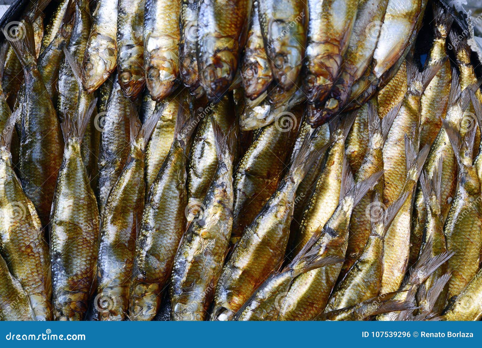 Golden smoked herrings fish sold in wet market. overhead shot