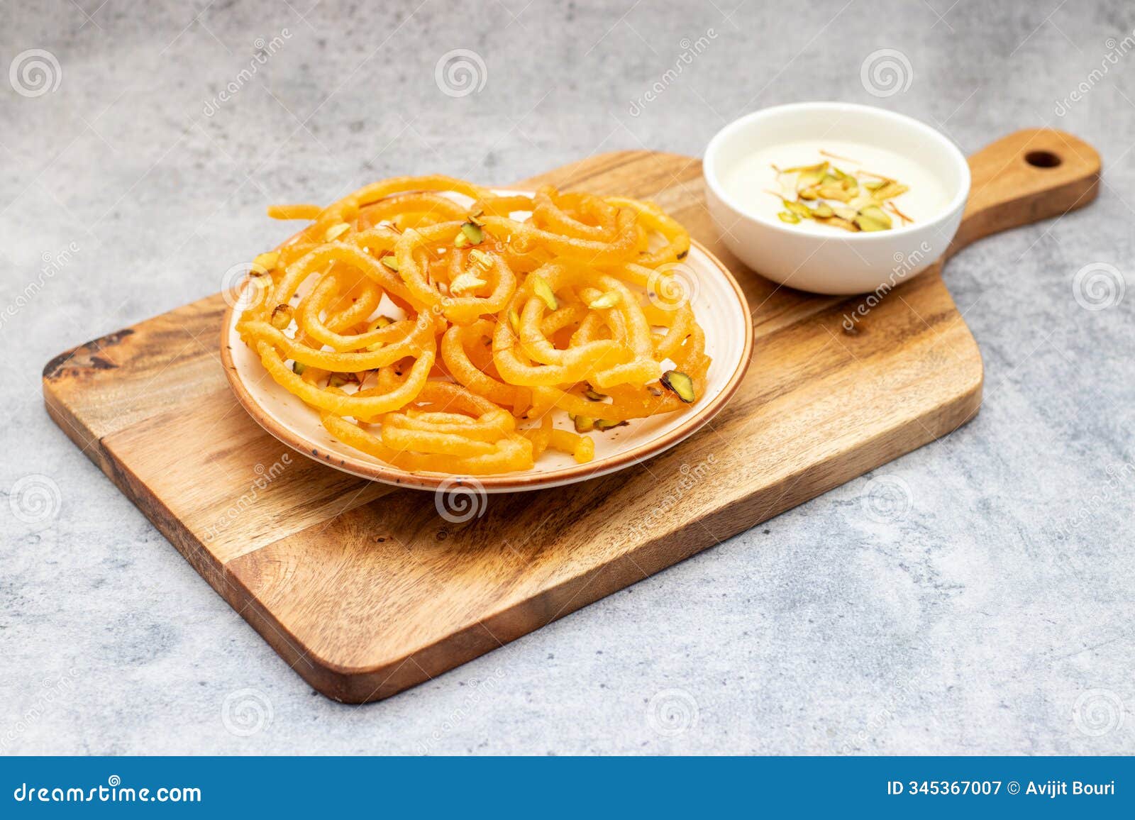 sweet, crispy jalebi drenched in syrup, served with creamy rabdi.