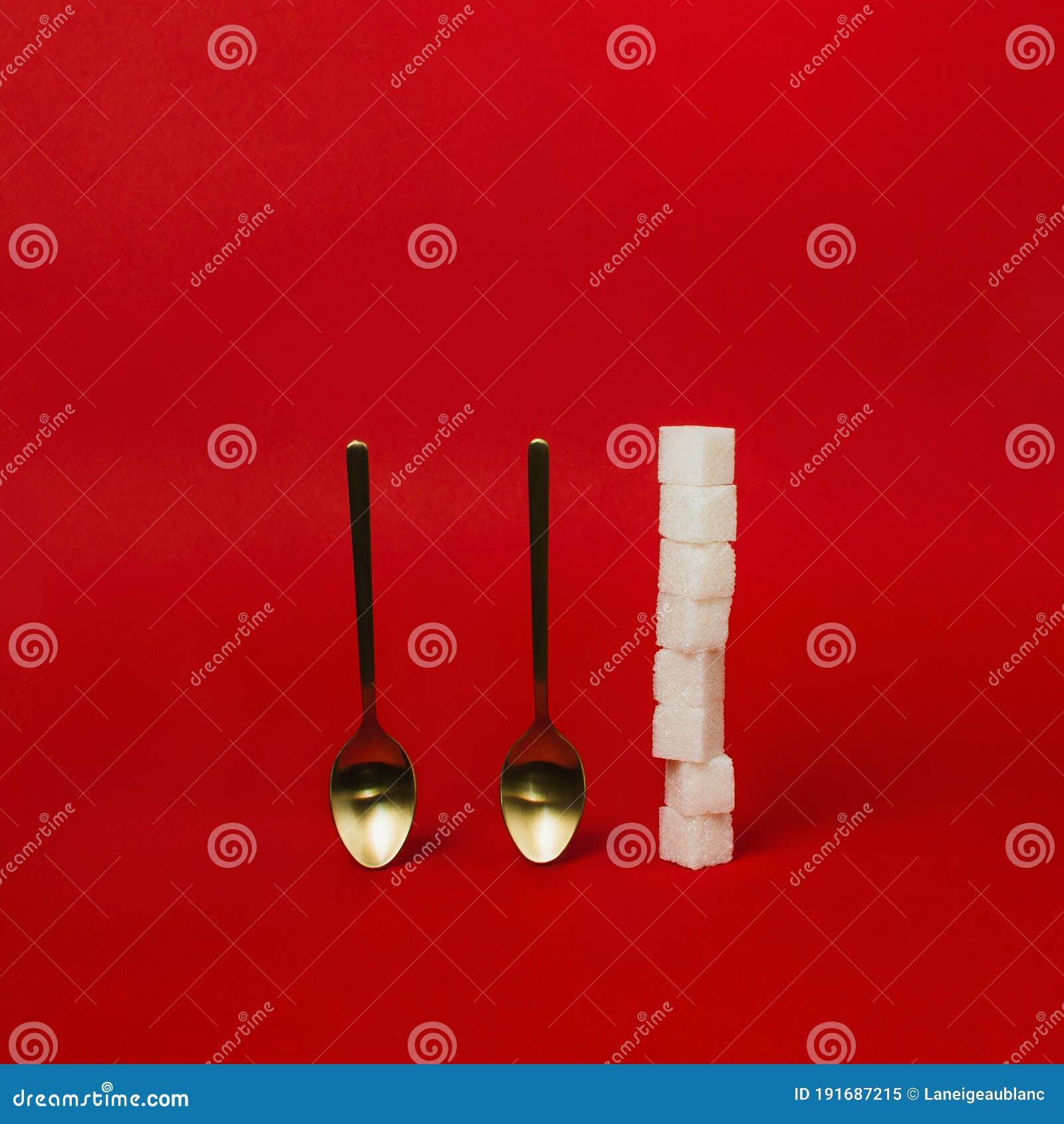 Golden Spoons and Stack of Sugar Cubes on Red Stock Image Image of