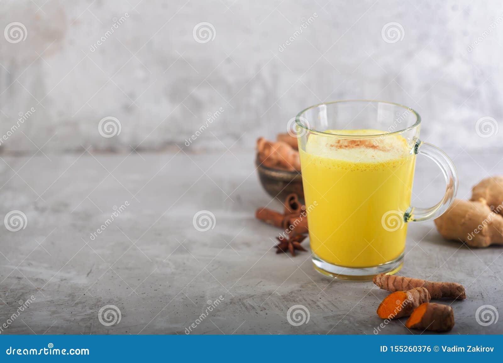 Golden Turmeric Milk on the Gray Background with Ingredients Stock ...