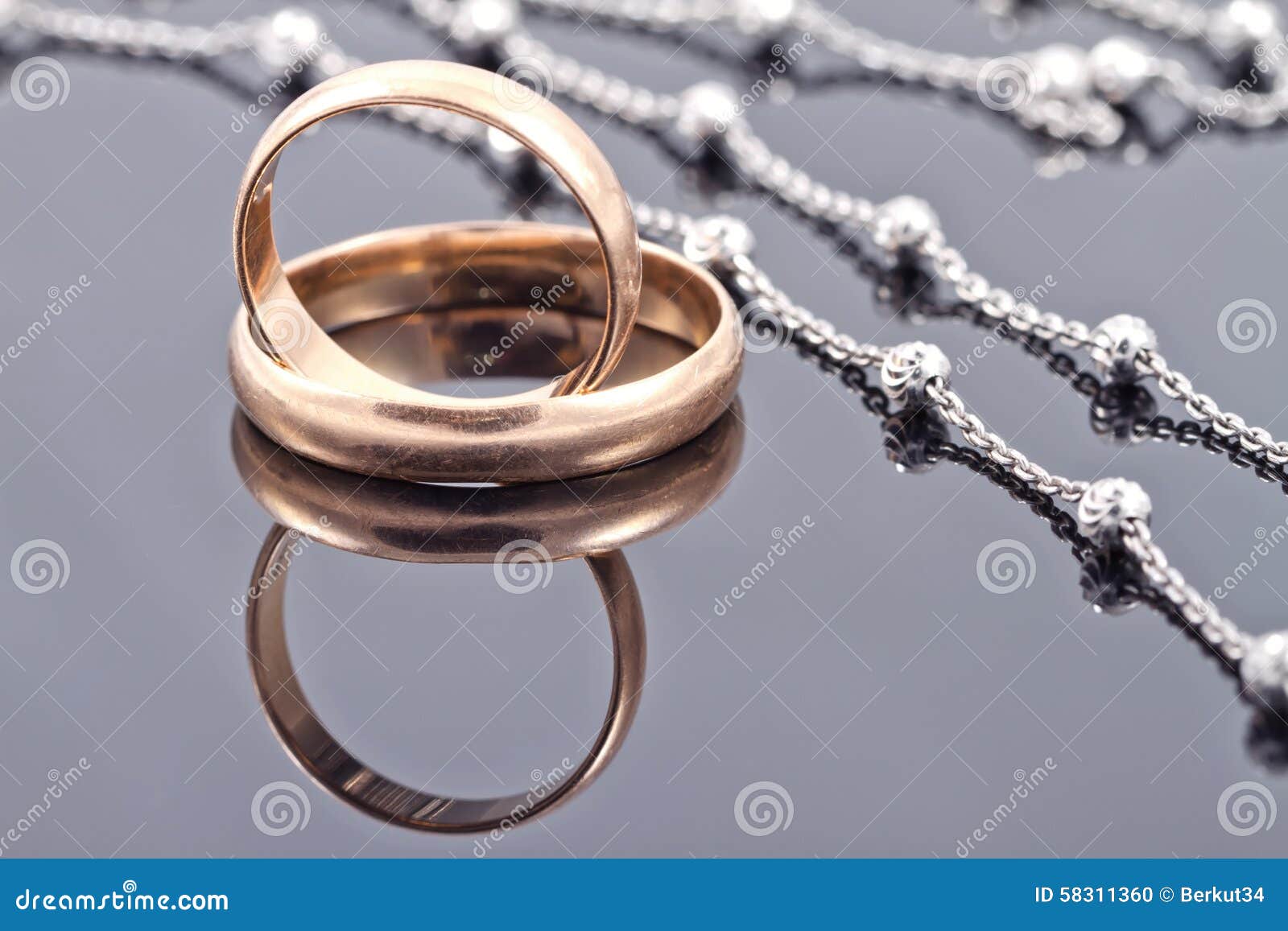 Golden Wedding Rings and Elegant Silver Chain Stock Photo Image of
