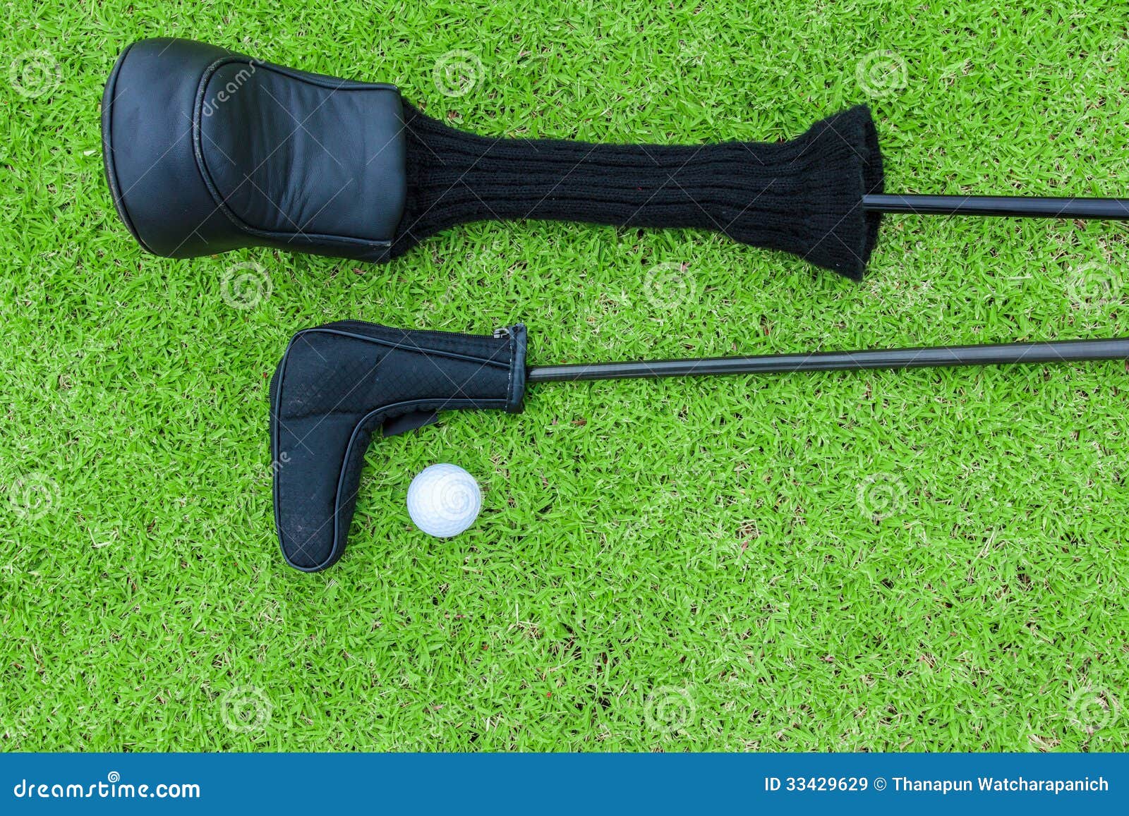 Golf Bags and Golf Ball on a Tee in Green Grass Course Stock Image