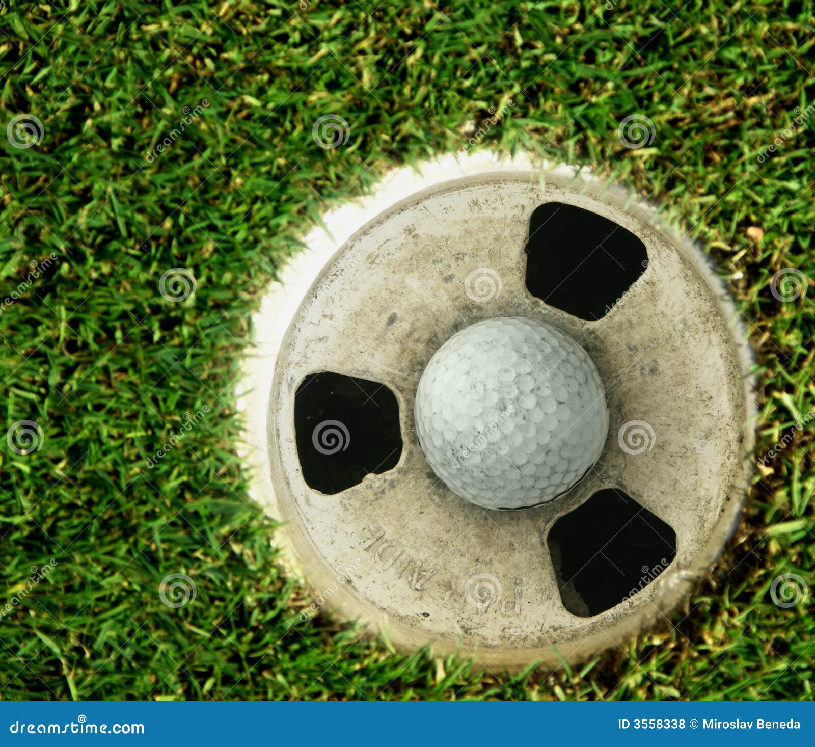 Golf Ball in Cup on Green stock photo. Image of golf, hole 3558338