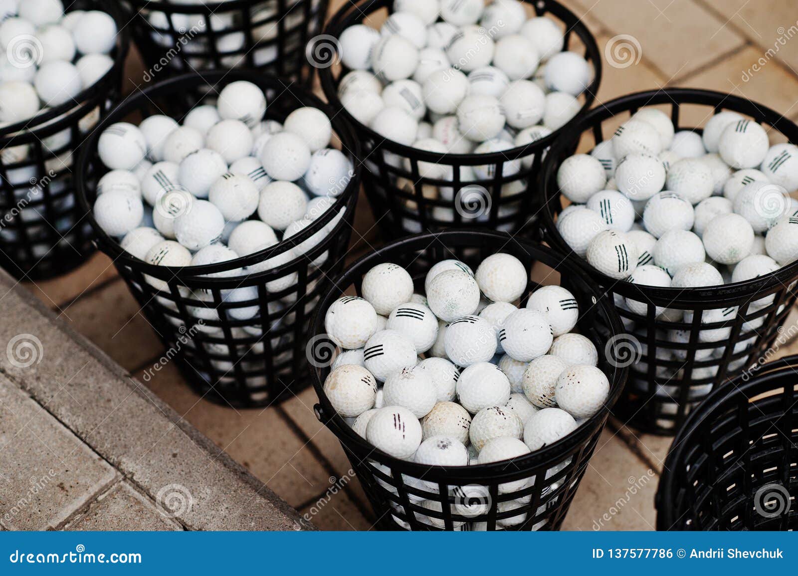 Golf Balls in a Baskets on Pavement Stock Photo - Image of outdoor
