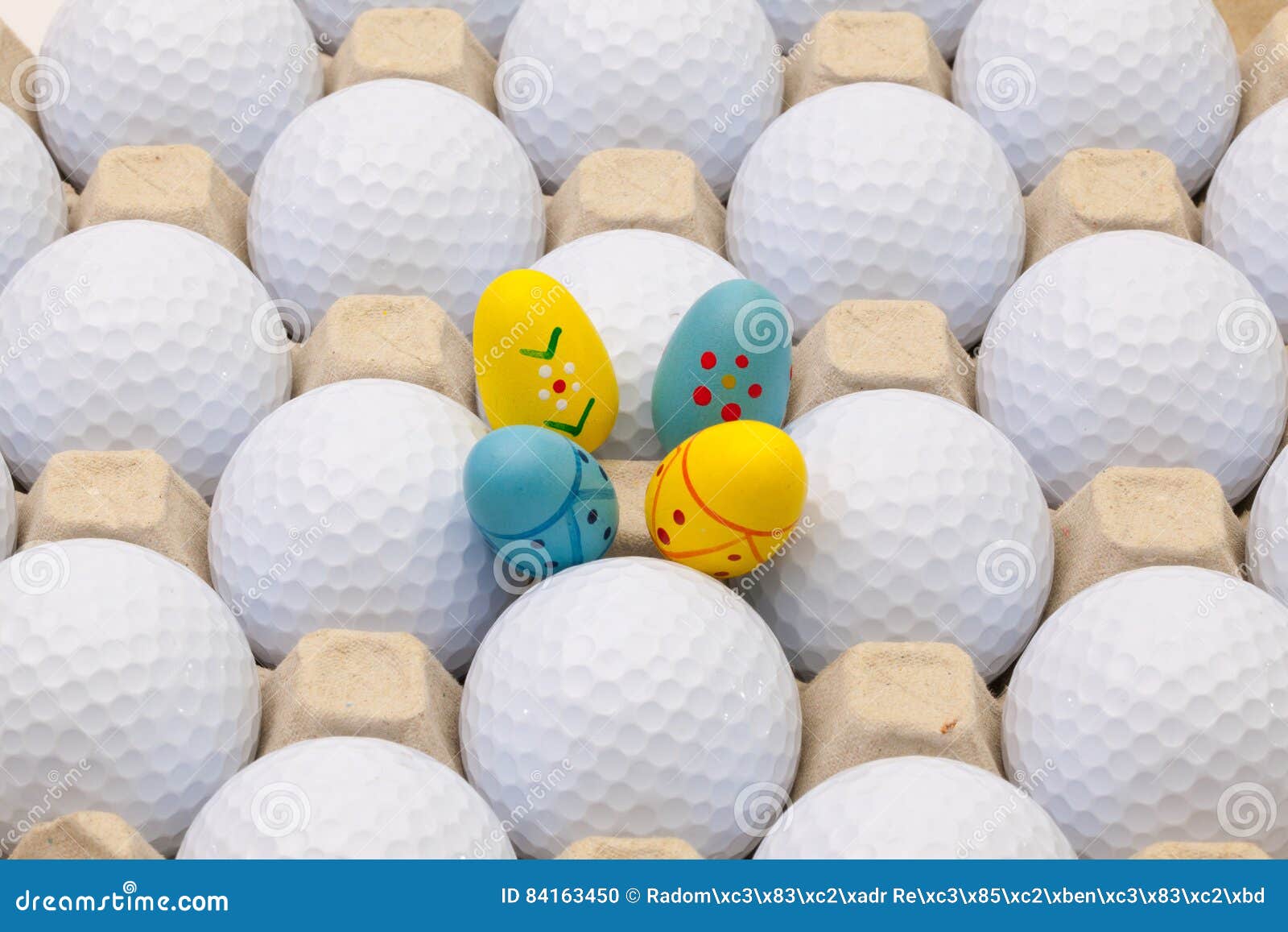 Golf Balls in the Box for Eggs and Easter Decoration Stock Photo