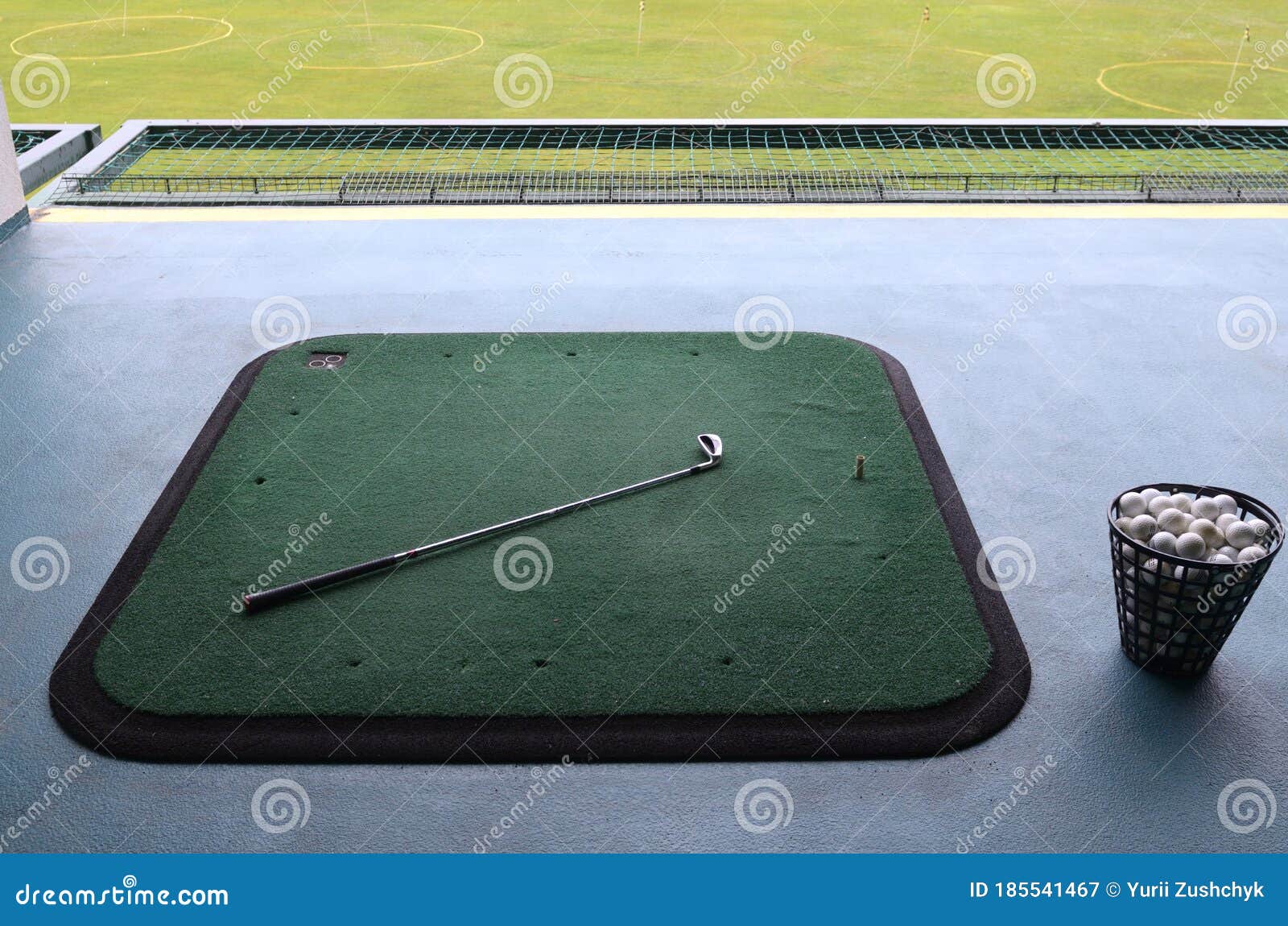 A Golf Course Carpets, Golf Clubs and Baskets with Balls Stock Image