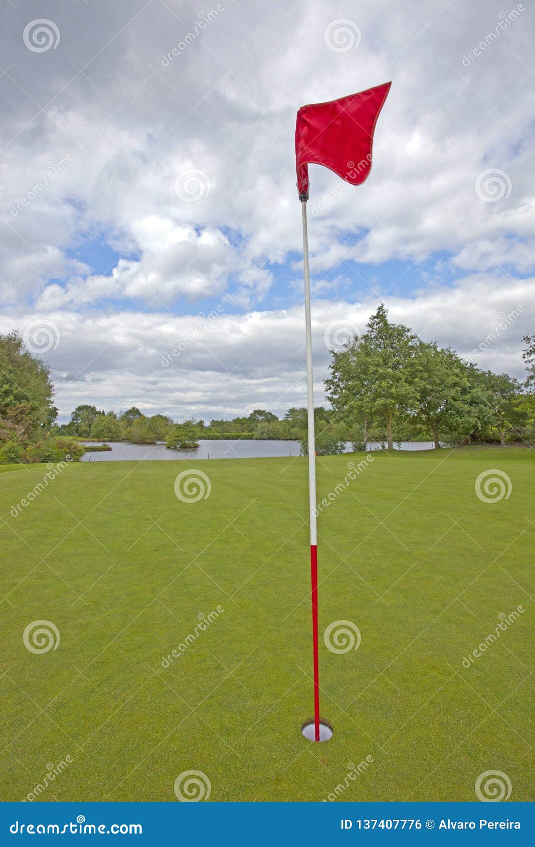 Golf Green with Red Golf Flag Stock Photo Image of luxury, clouds