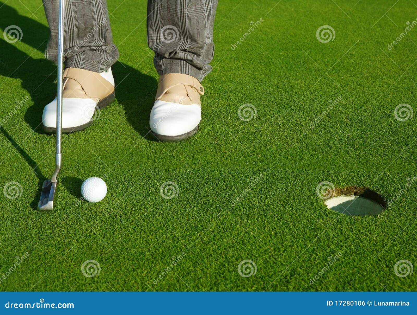 golf green hole course man putting short ball