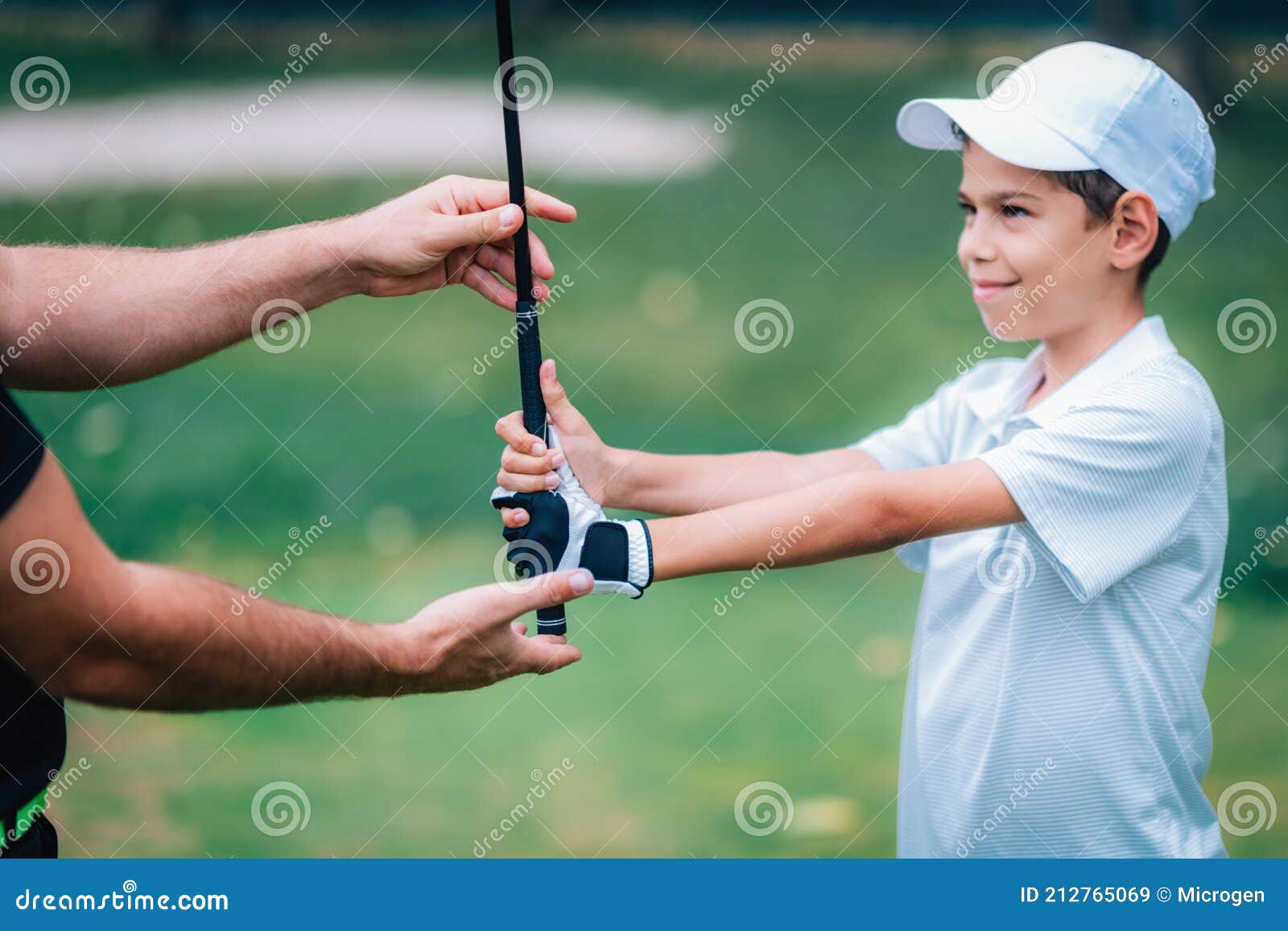 Golf Instructor Adjusting Young Boyâ€™s Grip Stock Image Image of
