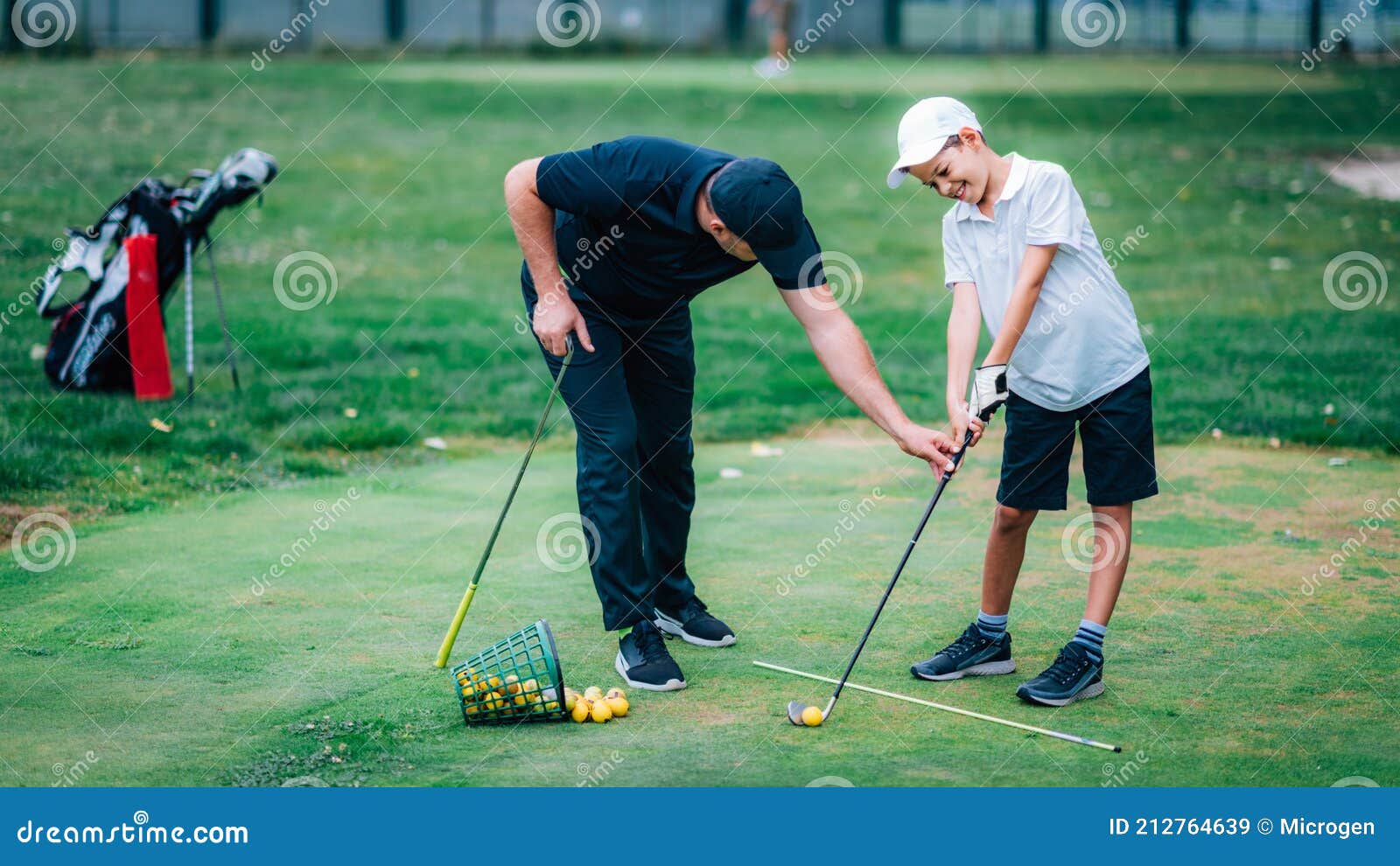 Golf â€“ Personal Training. Golf Instructor Teaching Young Boy How To