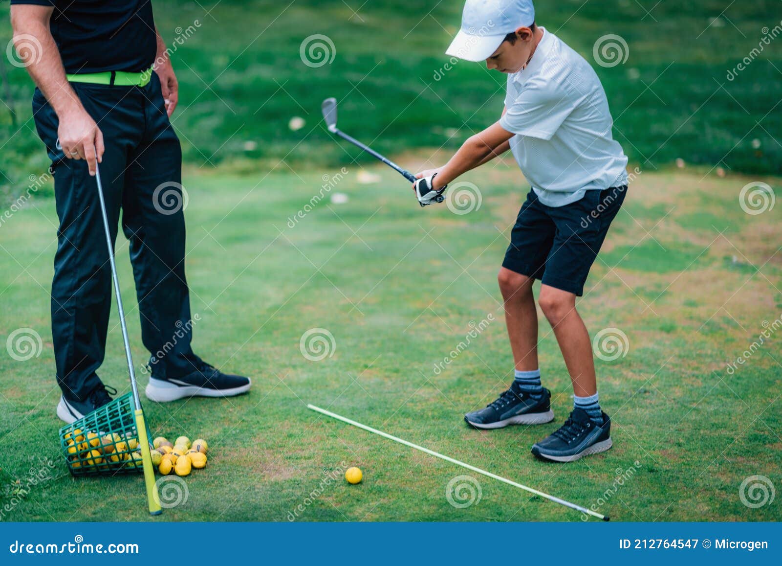 Golf â€“ Personal Training. Golf Instructor Teaching Young Boy How To