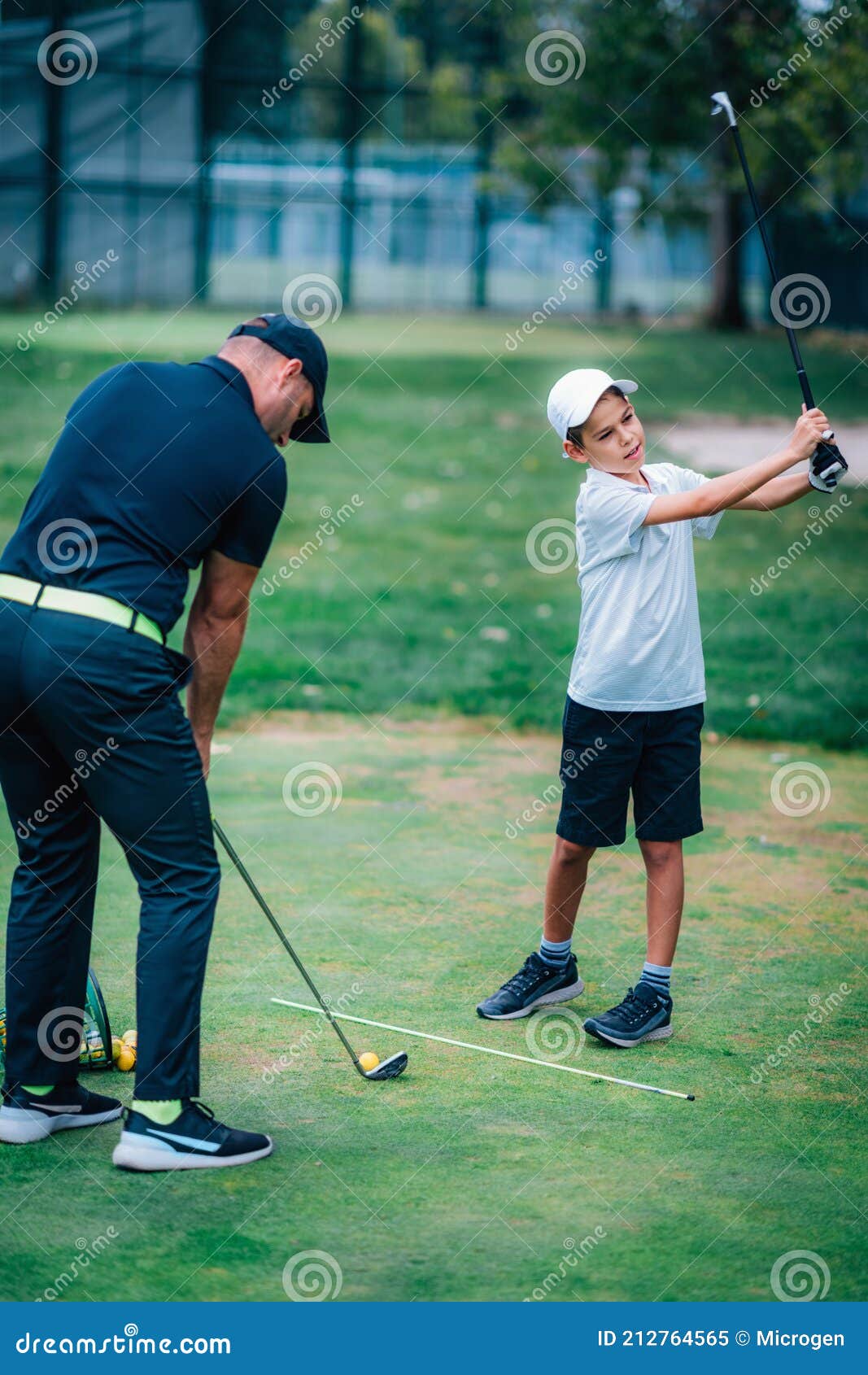 Golf â€“ Personal Training. Golf Instructor Teaching Young Boy How To