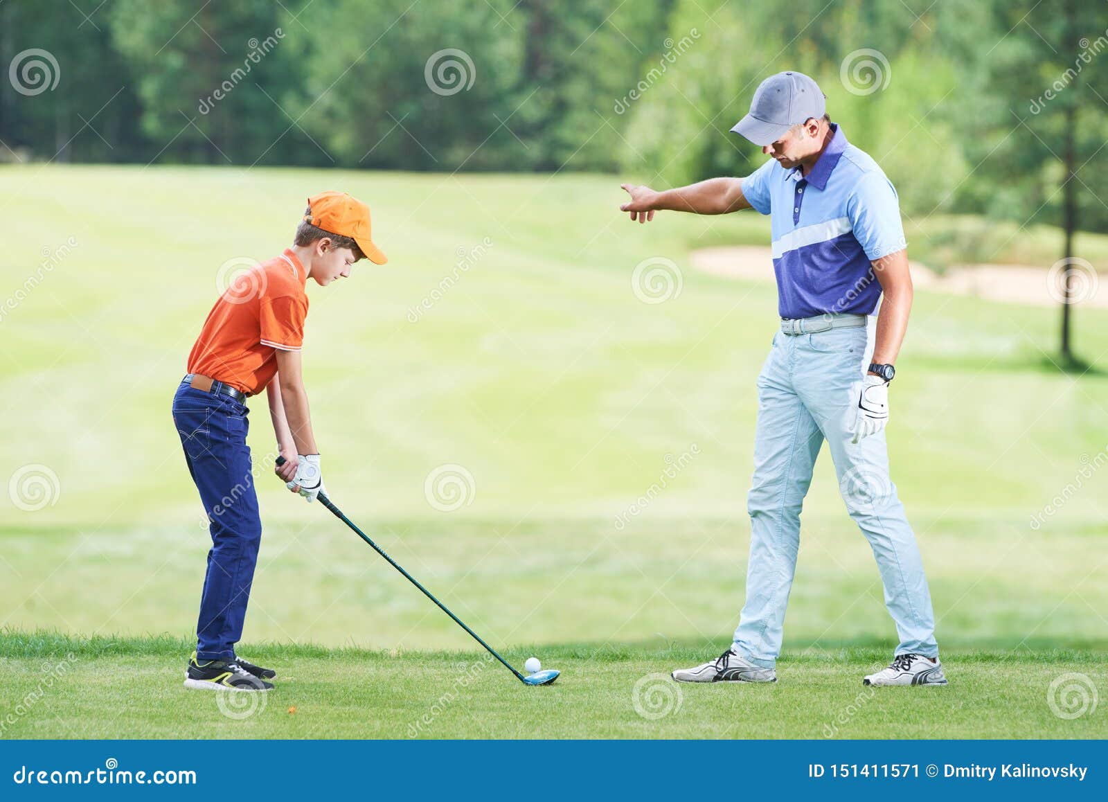 Boy Playing Golf in Summer with Trainer Stock Image Image of child