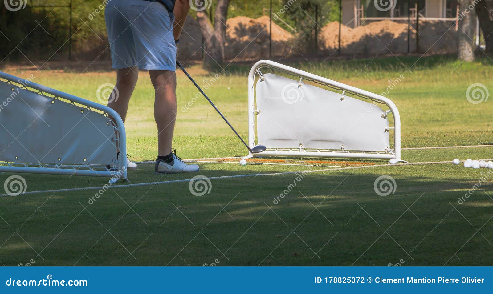 Golf Player Making a Swing with a Golf Fairway Wood Course Stock Photo