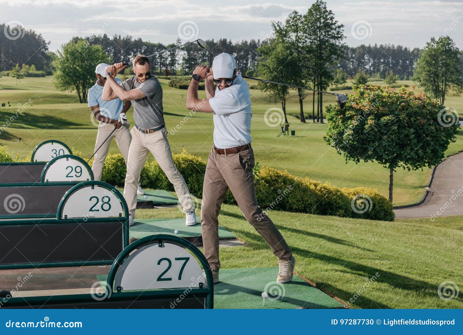Golf Players Playing Golf Together at Golf Course Stock Photo Image