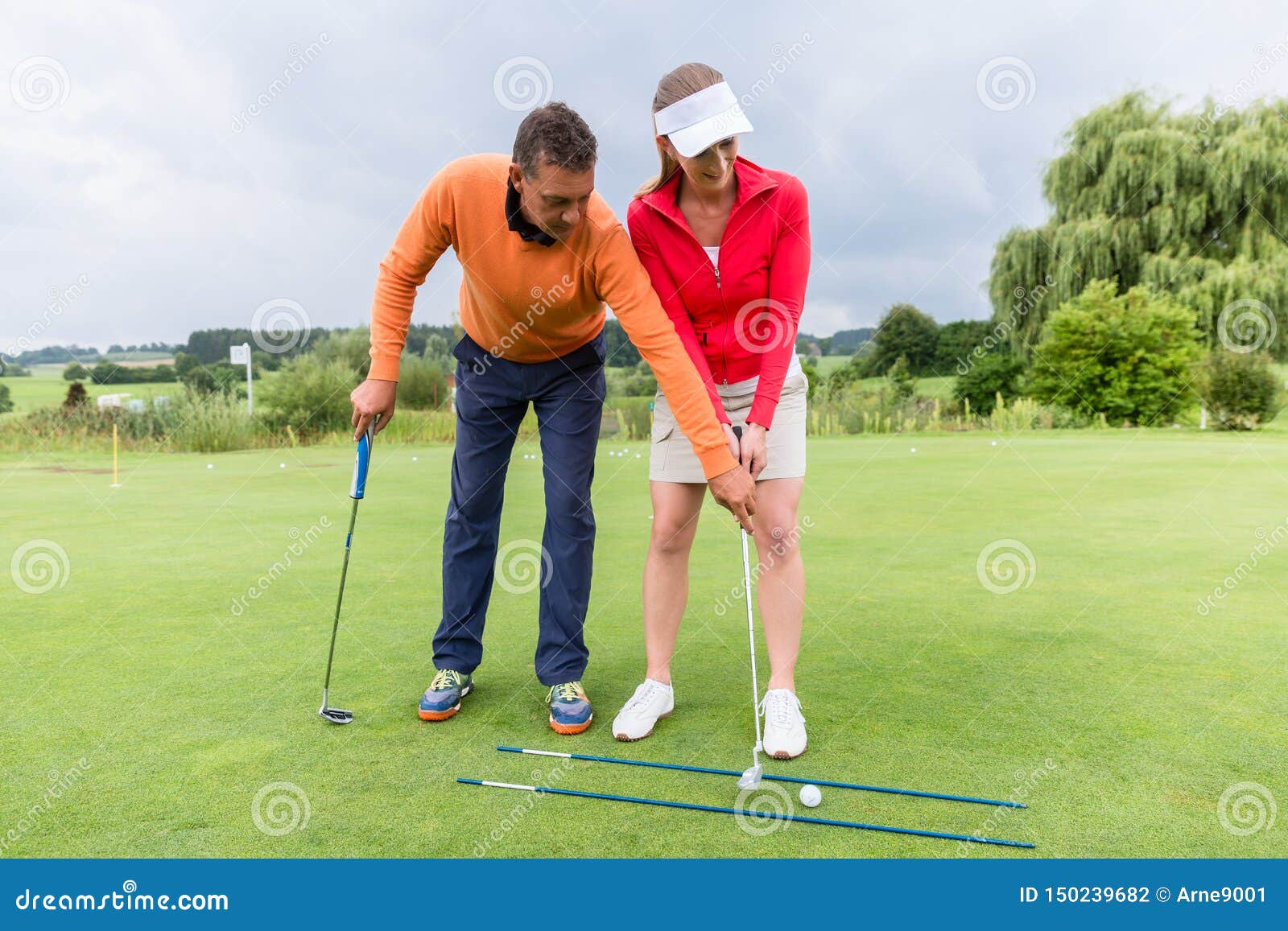 Golf Trainer Helping the Female Player Stock Photo Image of casual