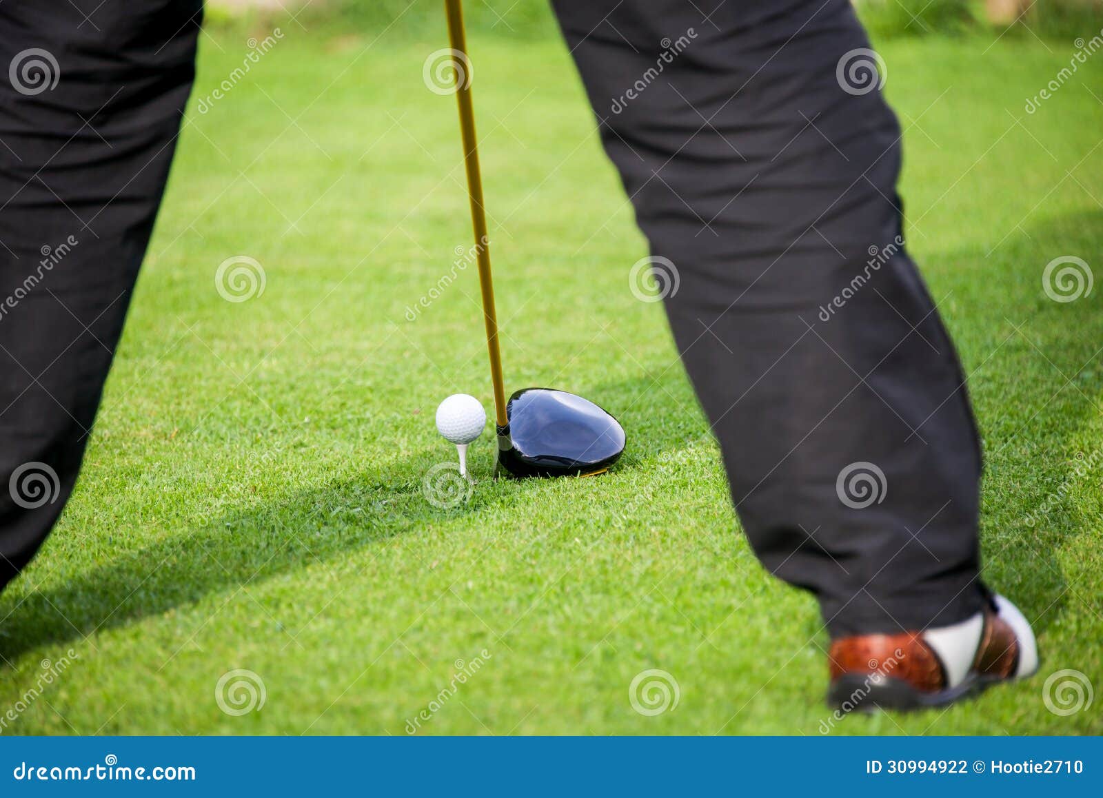 Golfer addresses golf ball stock photo. Image of golfer 30994922
