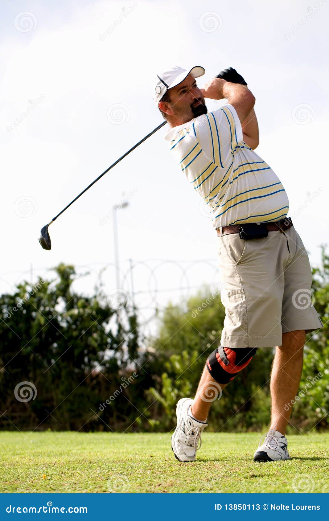 Golfer with knee brace. stock image. Image of drive, club - 13850113