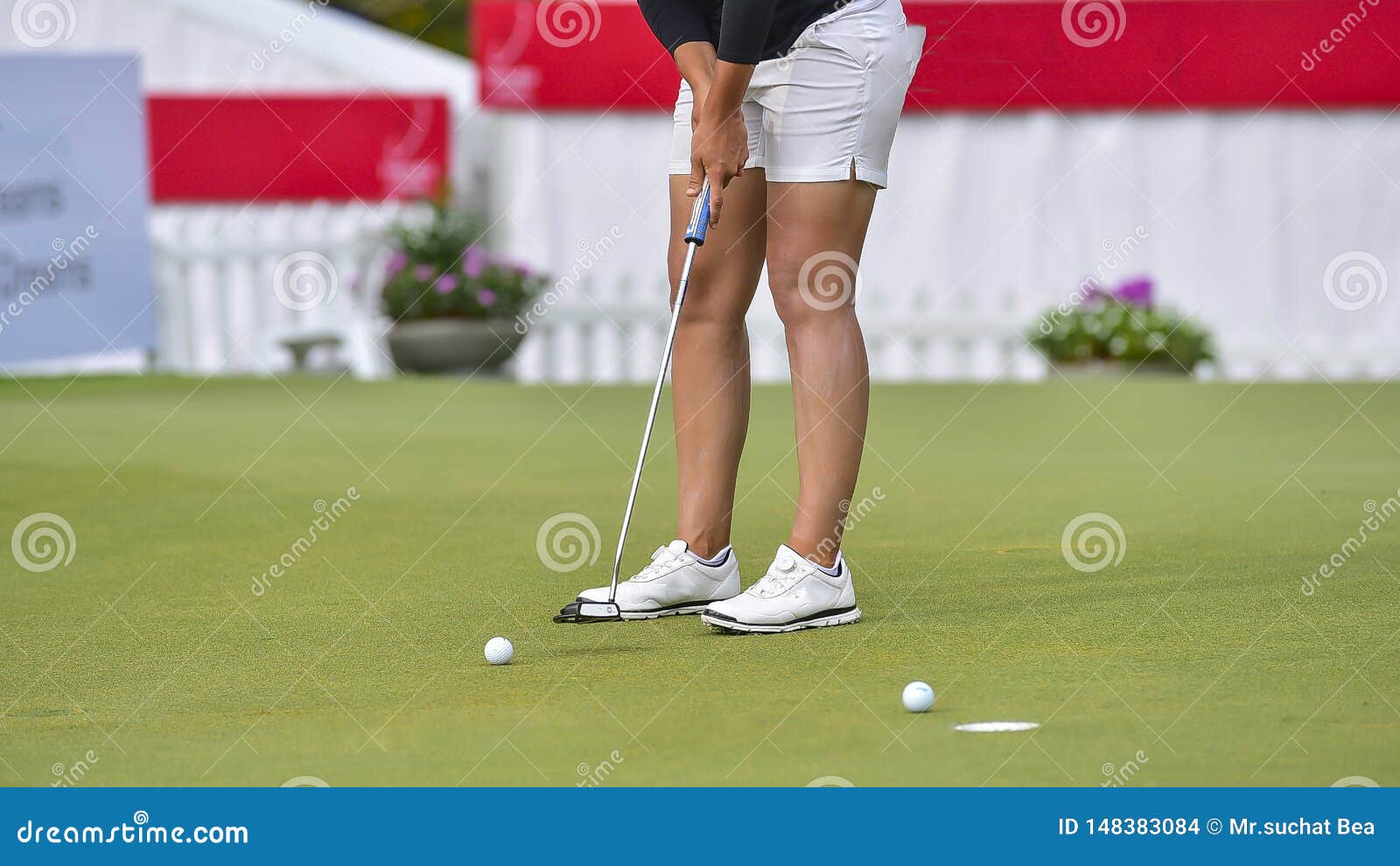 Golfer is Pushing Golf Ball by Golf Club from Tee Boxes at Golf Course