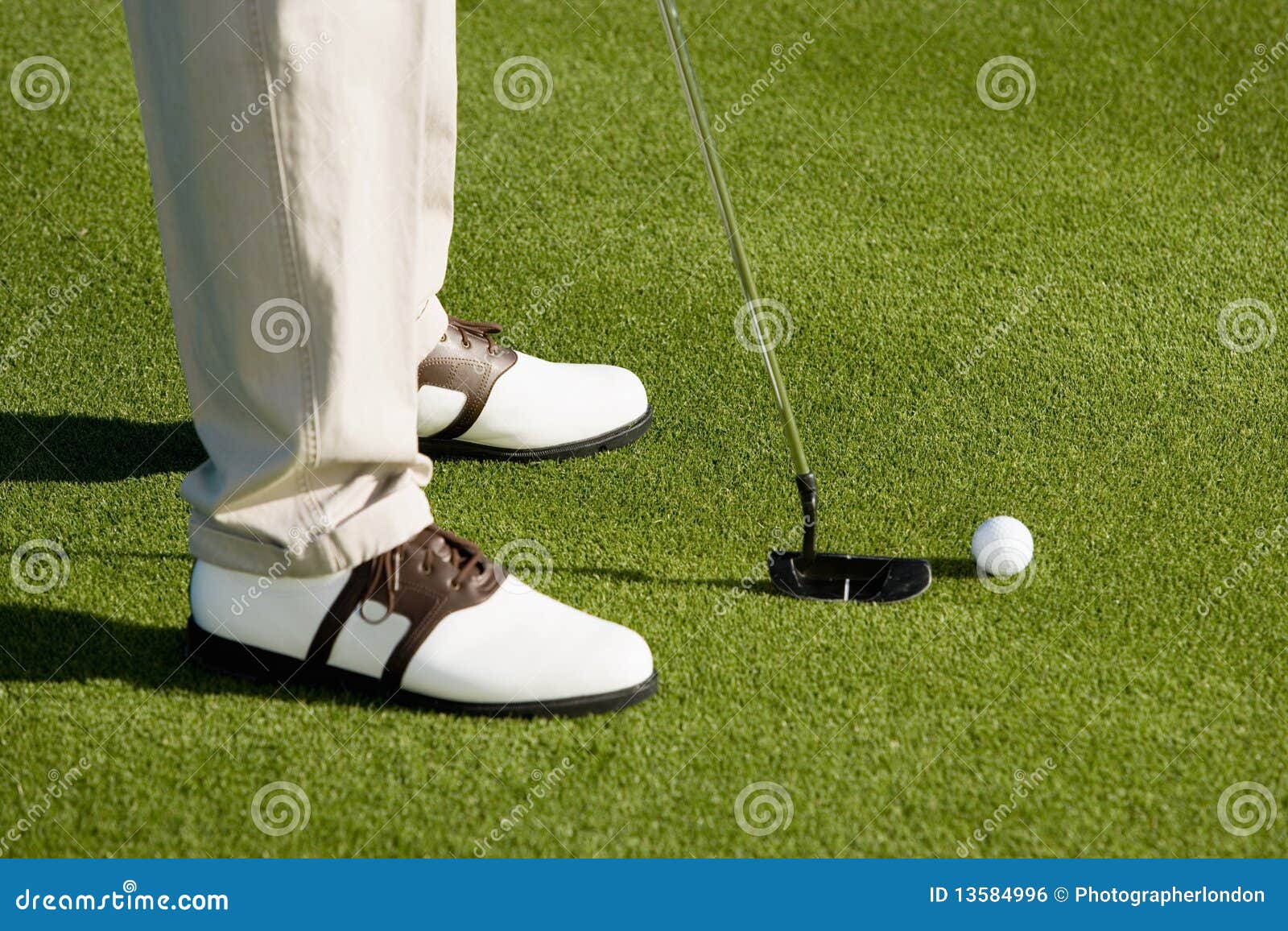 Golfer putting on green stock photo. Image of young, putting 13584996