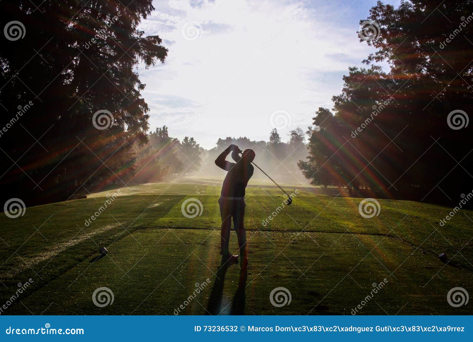 golfer silhouette at dawn