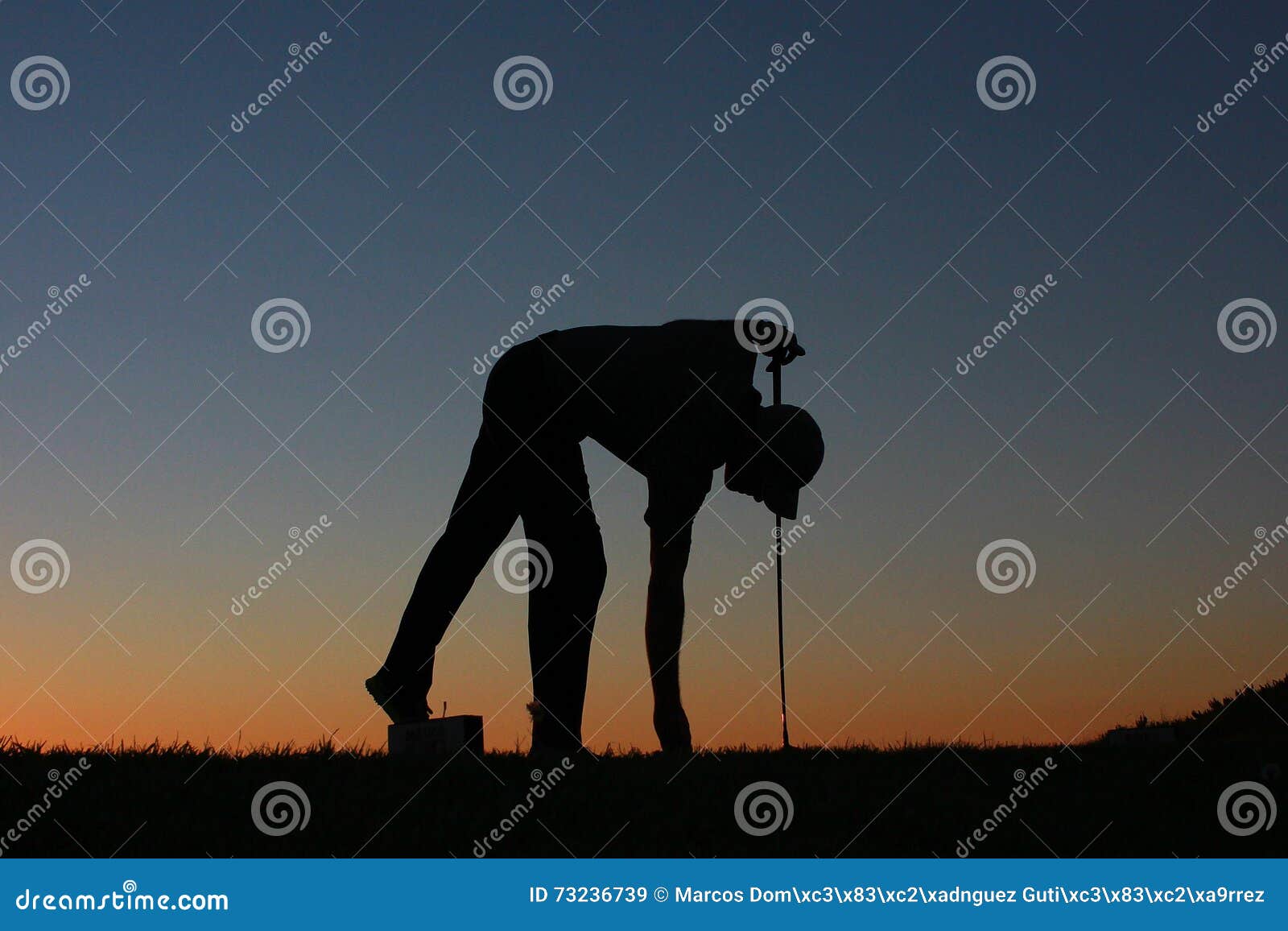 golfer silhouette at sunset