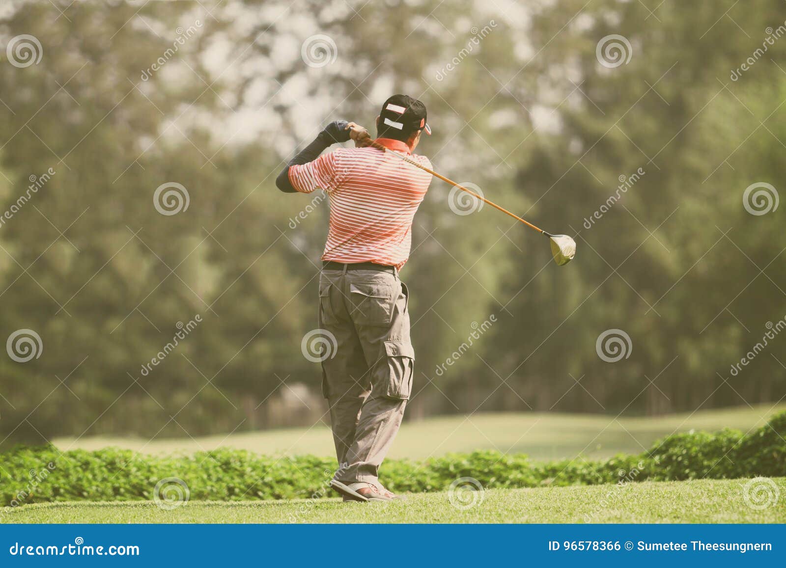 Golfers Hit Sweeping and Keep Golf Course in the Summer for Rel Stock