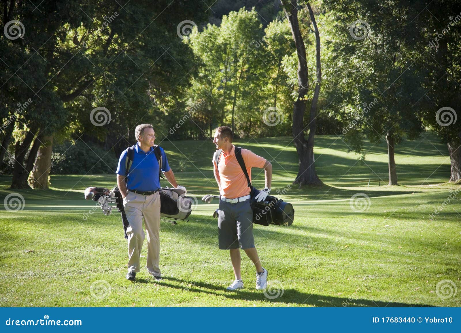 golfers talking on the course