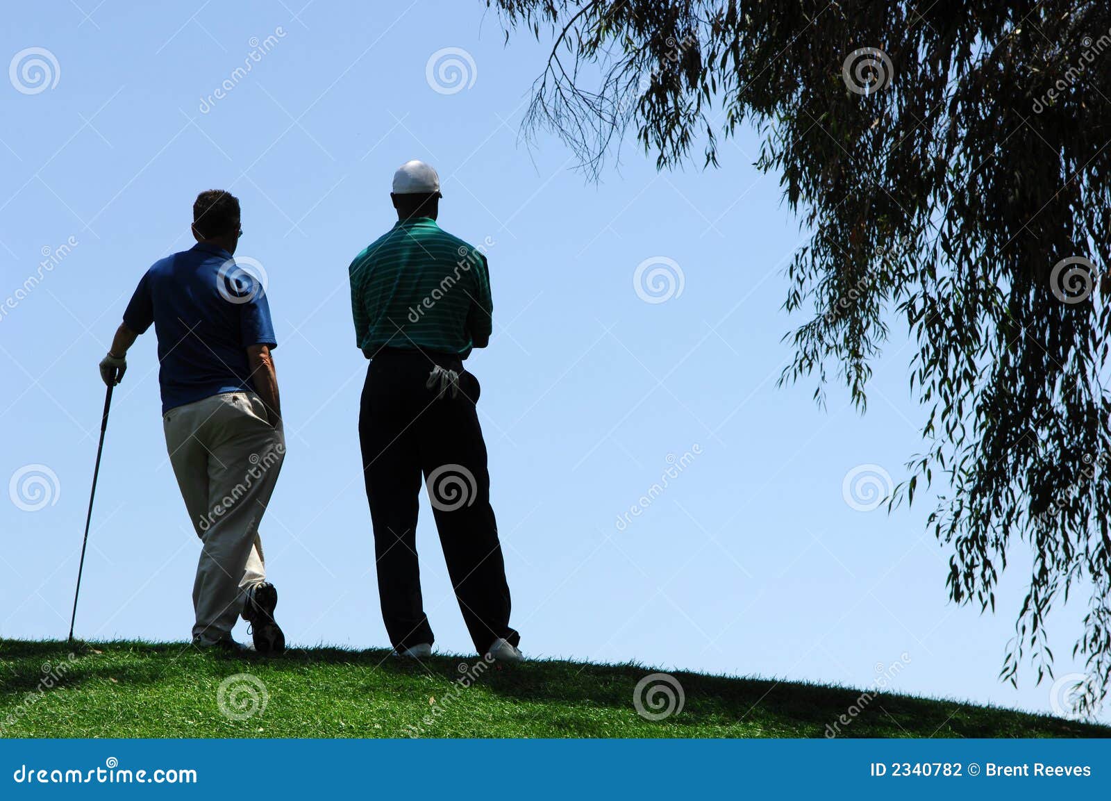 golfers wait for turn to putt