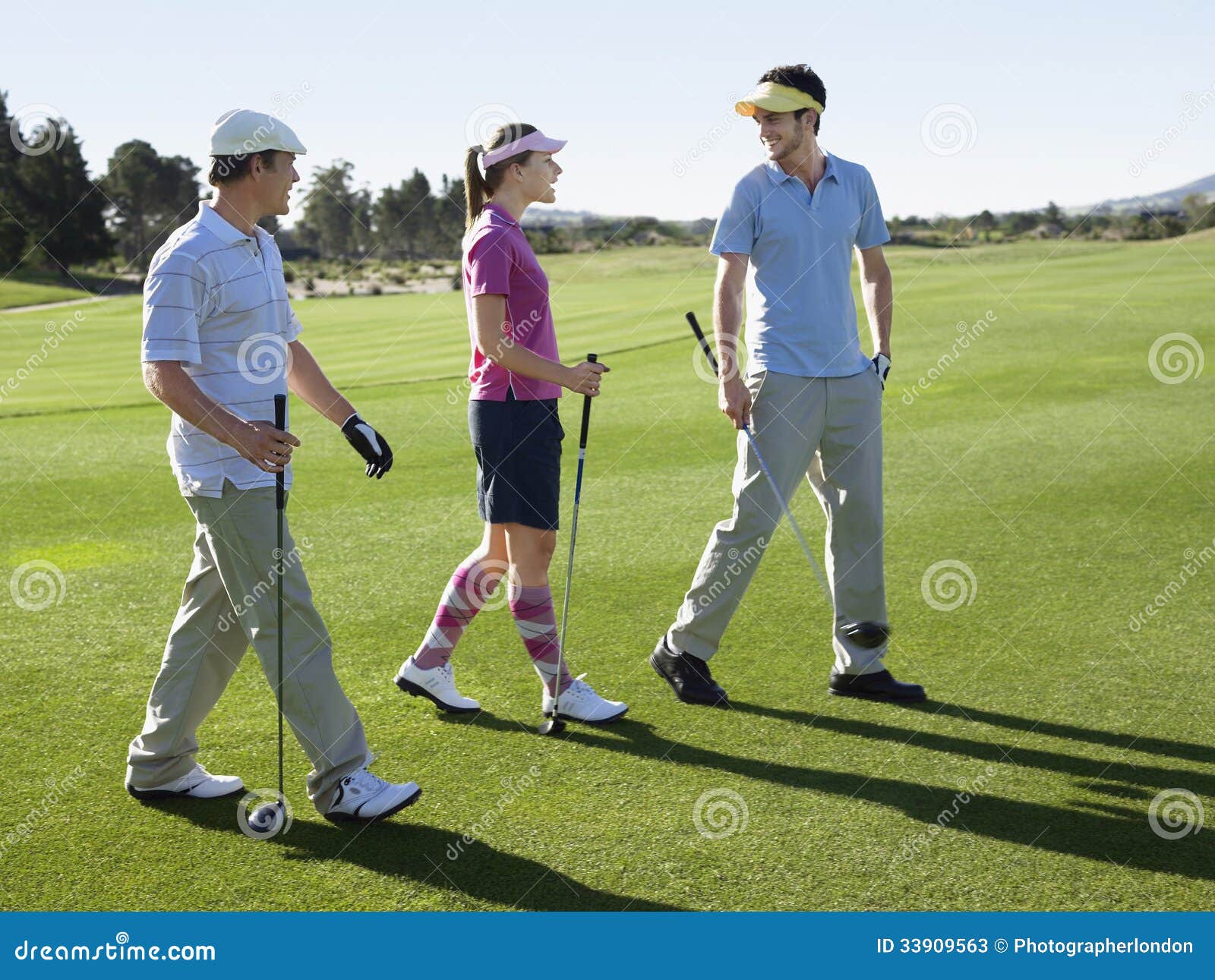 Golfers Walking On Golf Course Stock Photos Image 33909563 Golfers Walking On Golf Course Stock Photos Image 33909563