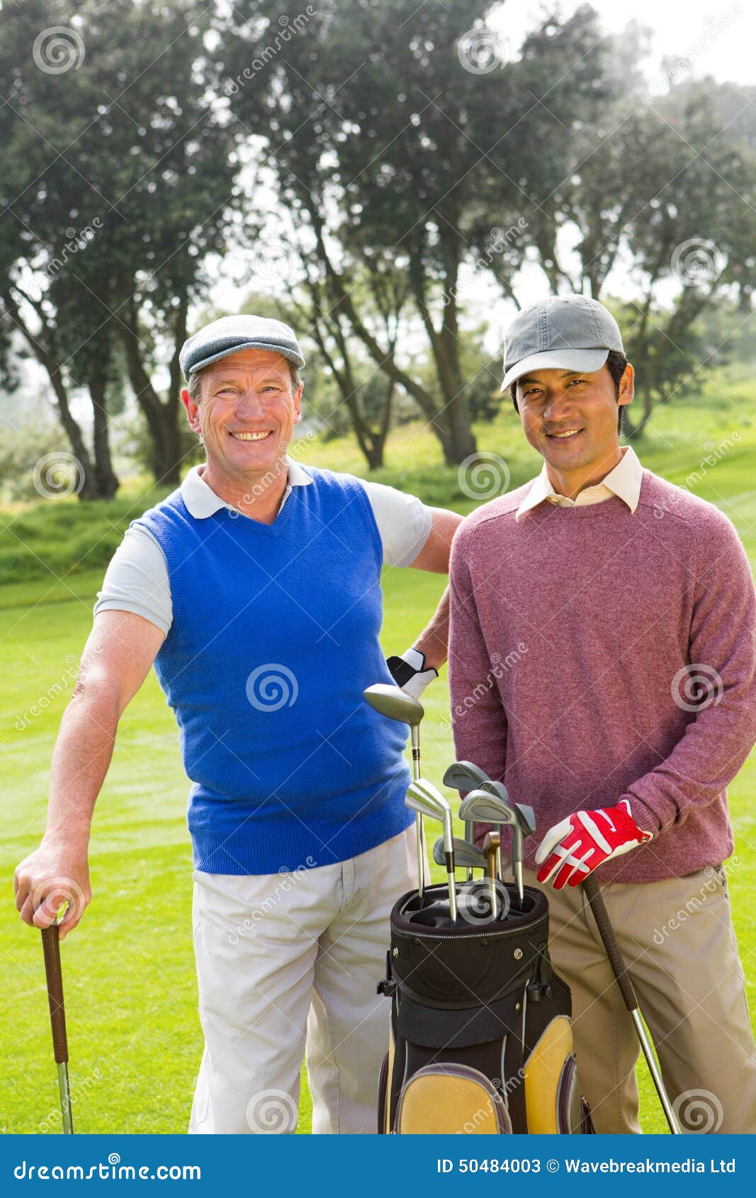 Golfing Friends Smiling at Camera Holding Clubs Stock Image Image of