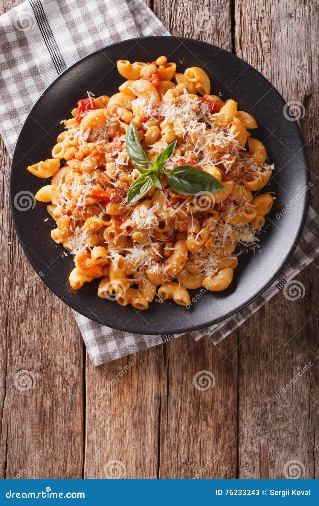 Gomiti Pasta with White Beans and Cheese on a Plate Close-up. Ve Stock ...