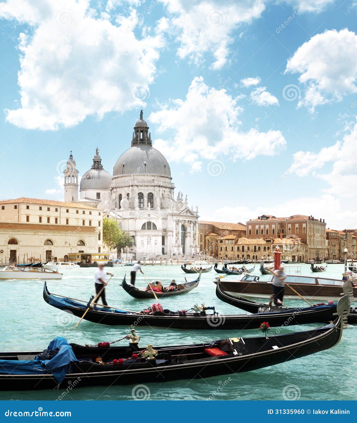 gondolas on canal and basilica santa maria della salute, venice, italy