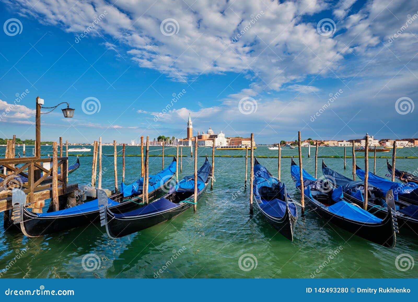Gondolas And In Lagoon Of Venice By San Marco Square