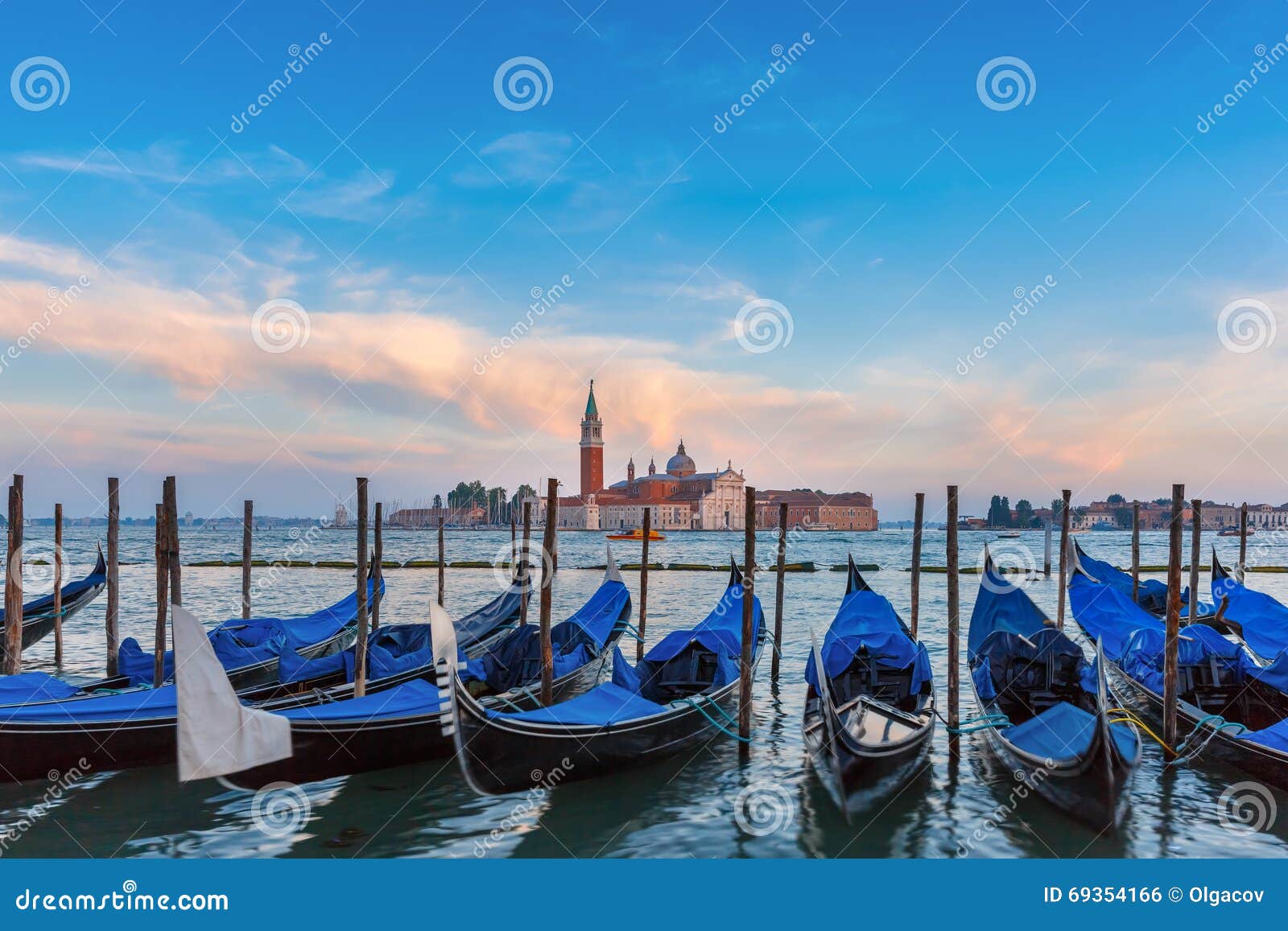 gondolas at twilight in venice lagoon, italia