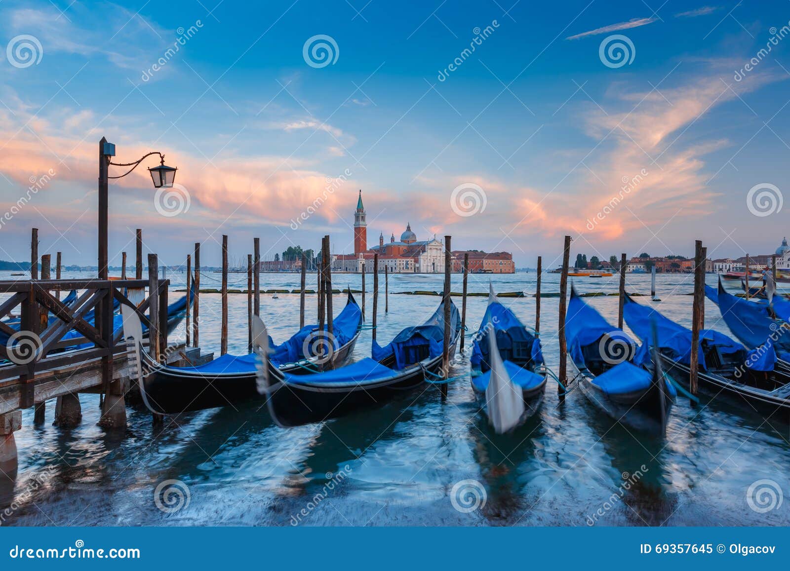 gondolas at twilight in venice lagoon, italia