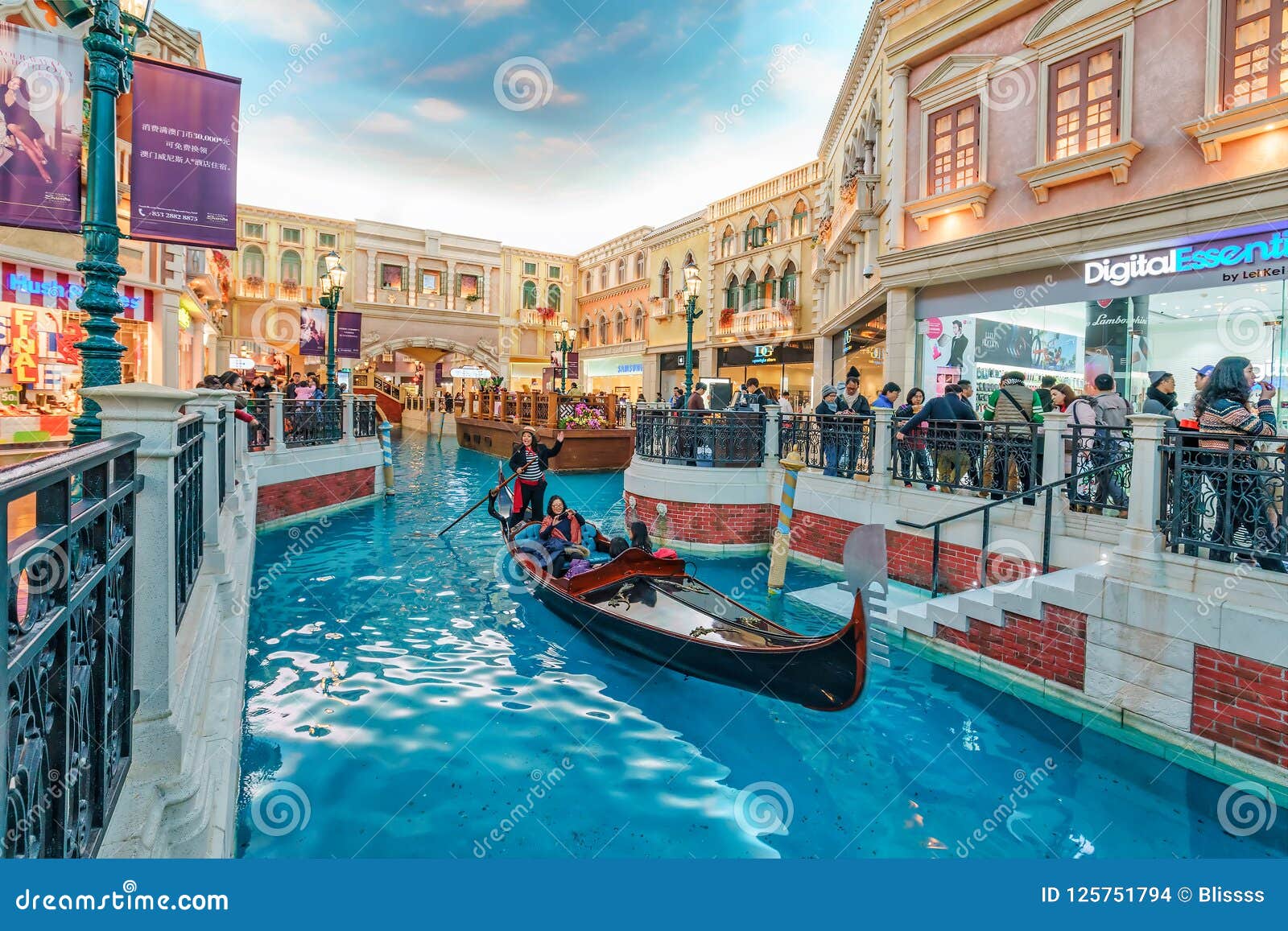 Download Gondolier Rides Tourists On Gondola Along Mock Canal Of ...