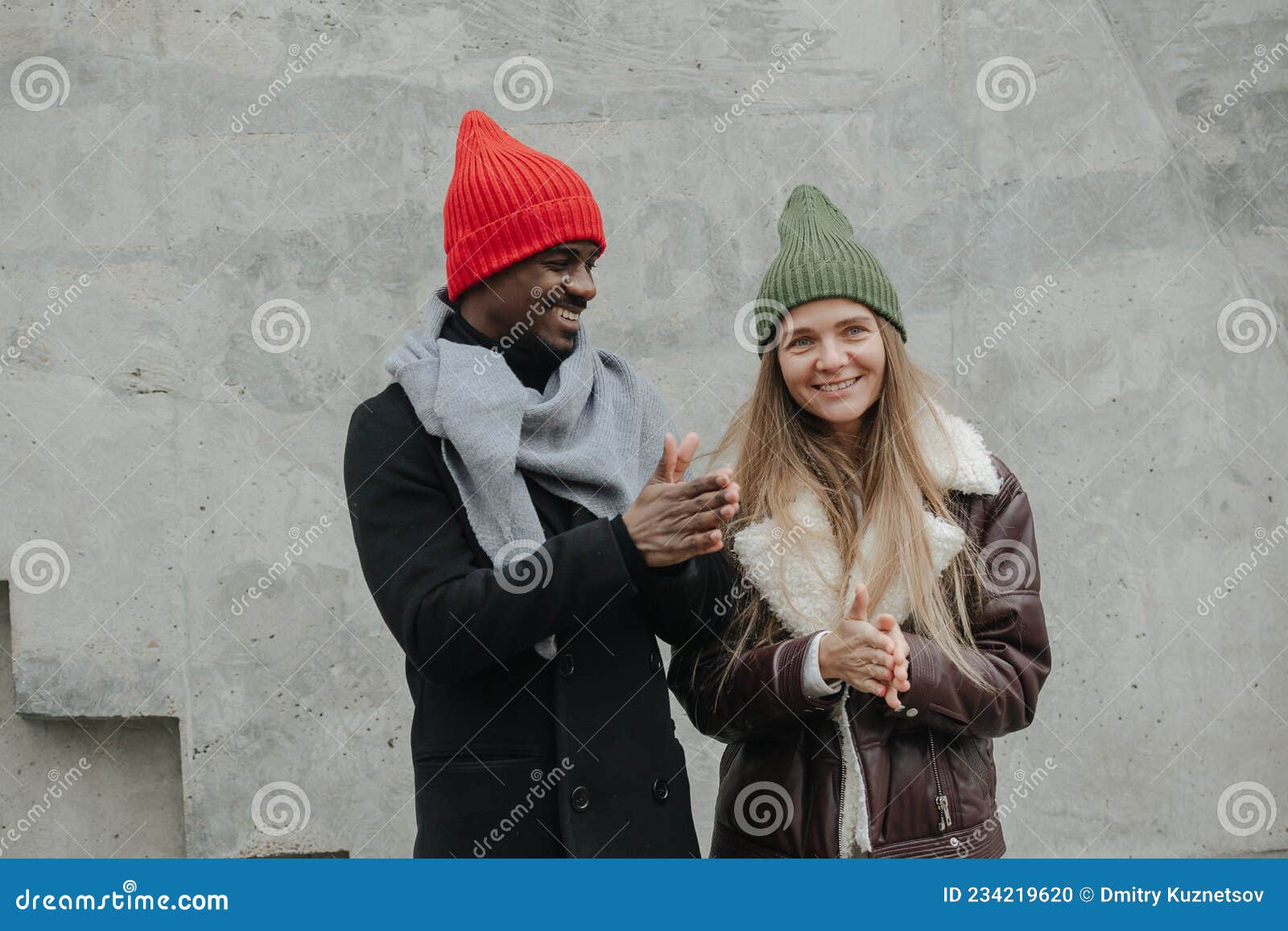 Good Opposite Sex Friends Hanging Out on the Street, Rubbing Hands for Warmth Stock Photo