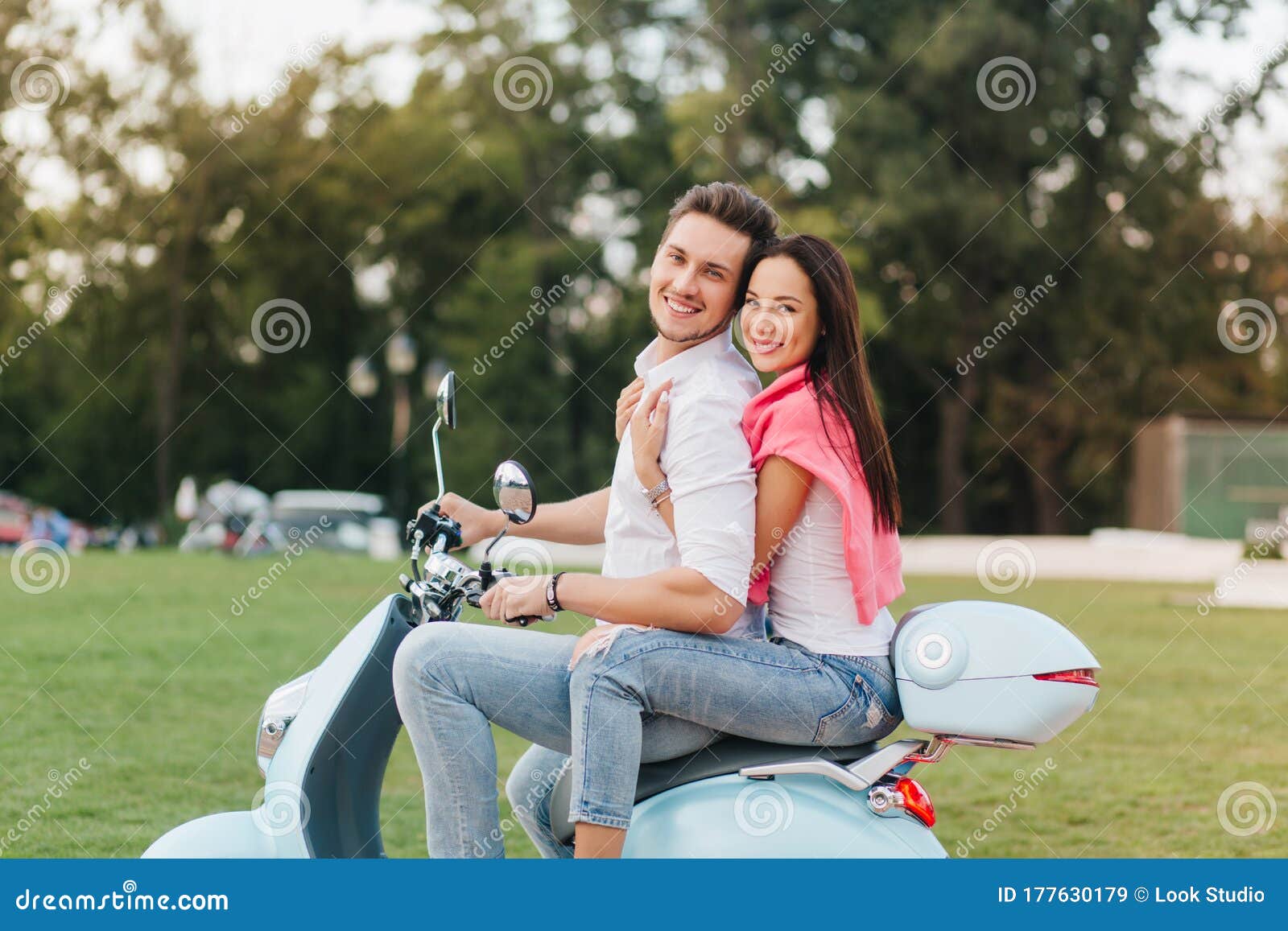 Good-looking Girl with Long Hairstyle Posing with Shy Smile on Scooter.  Glad Young Man in Casual Clothes Sitting on Bike Stock Image - Image of  beautiful, cute: 177630179
