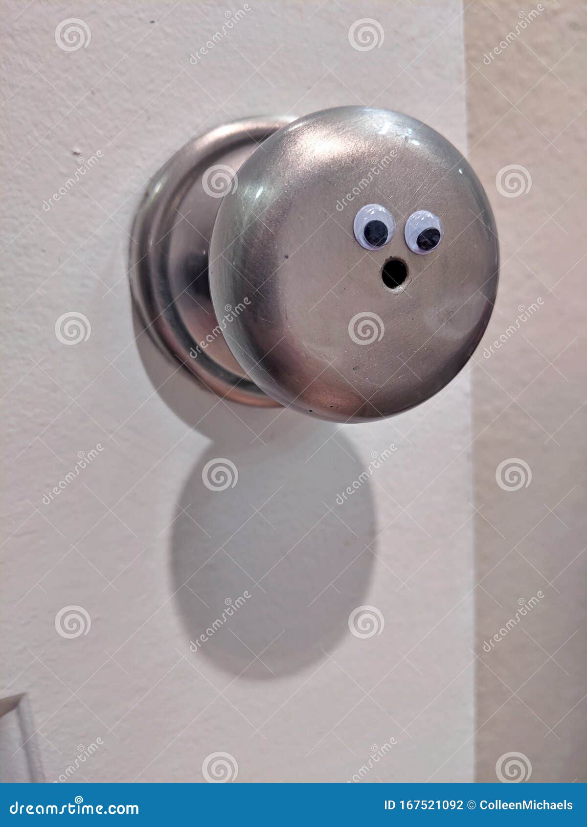 Googly Eyes on a Door Knob, Creating a Surprised Expression Stock Photo Image of brown