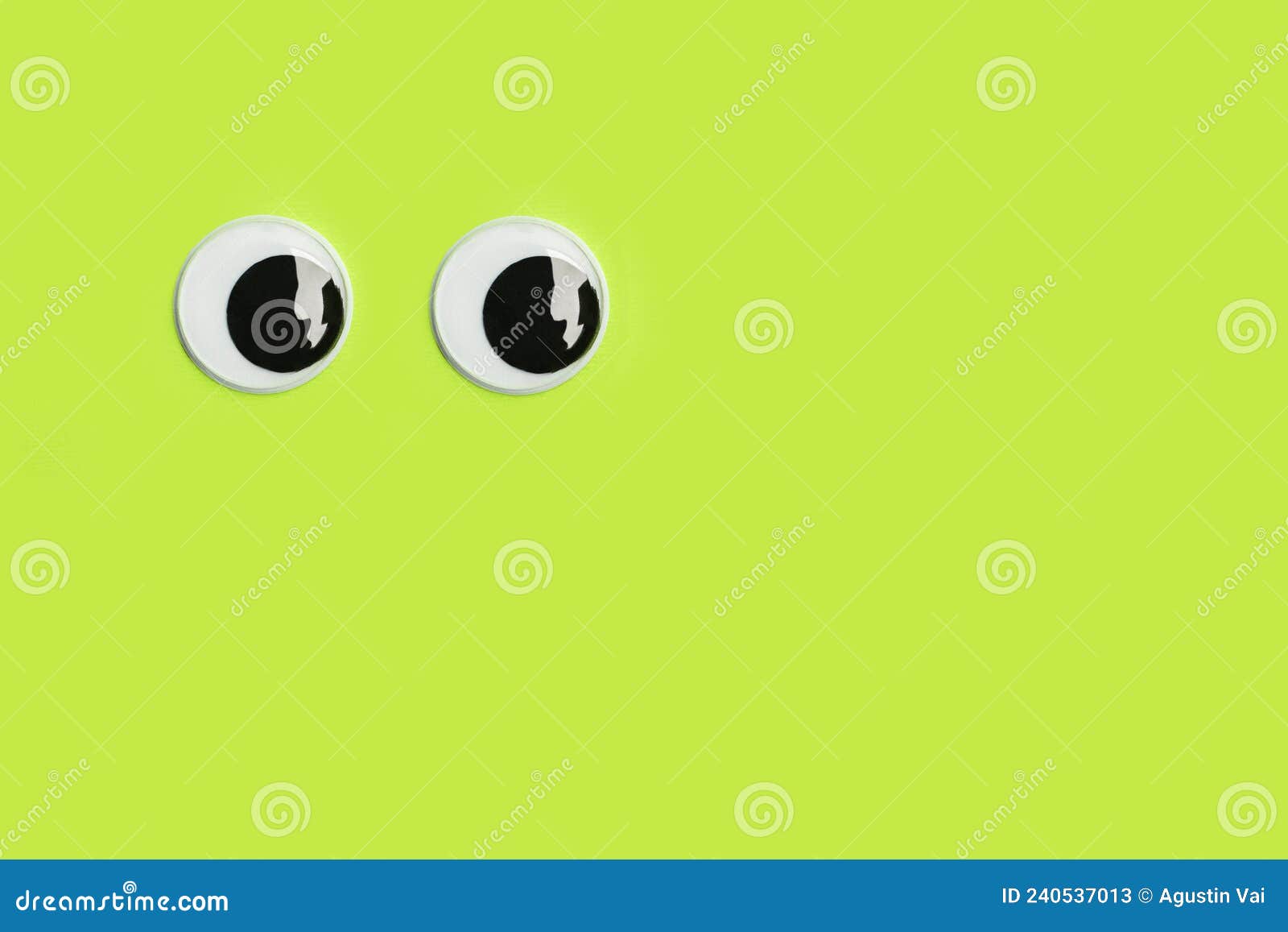 Googly Eyes on a Green Background with Copy Space Stock Image Image