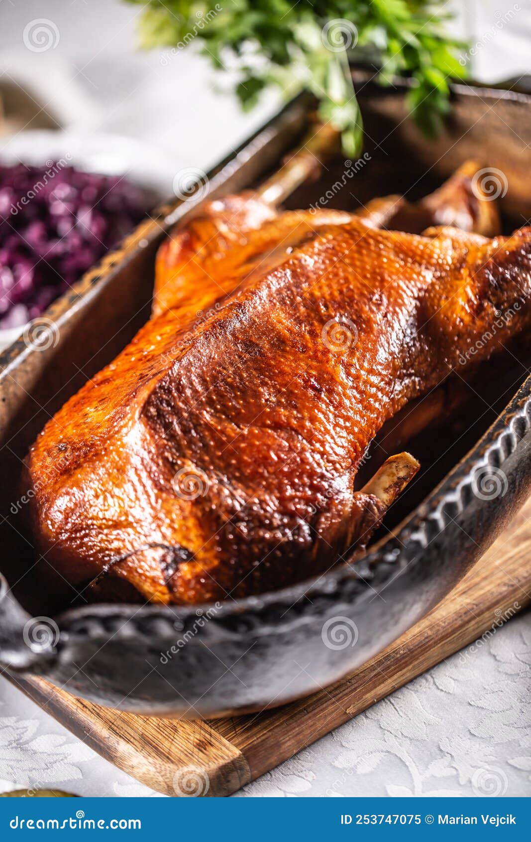 goose feasts and roast goose in the oven on the festive table